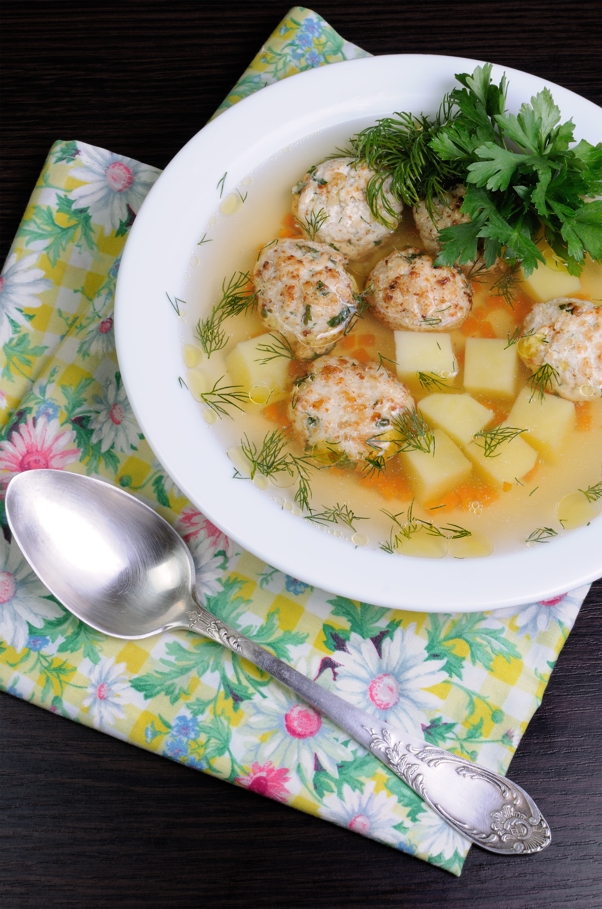 Overhead flat-lay of all ingredients for Greek Avgolemono Meatballs with Dill and Lemon Broth laid out on a kitchen surface.