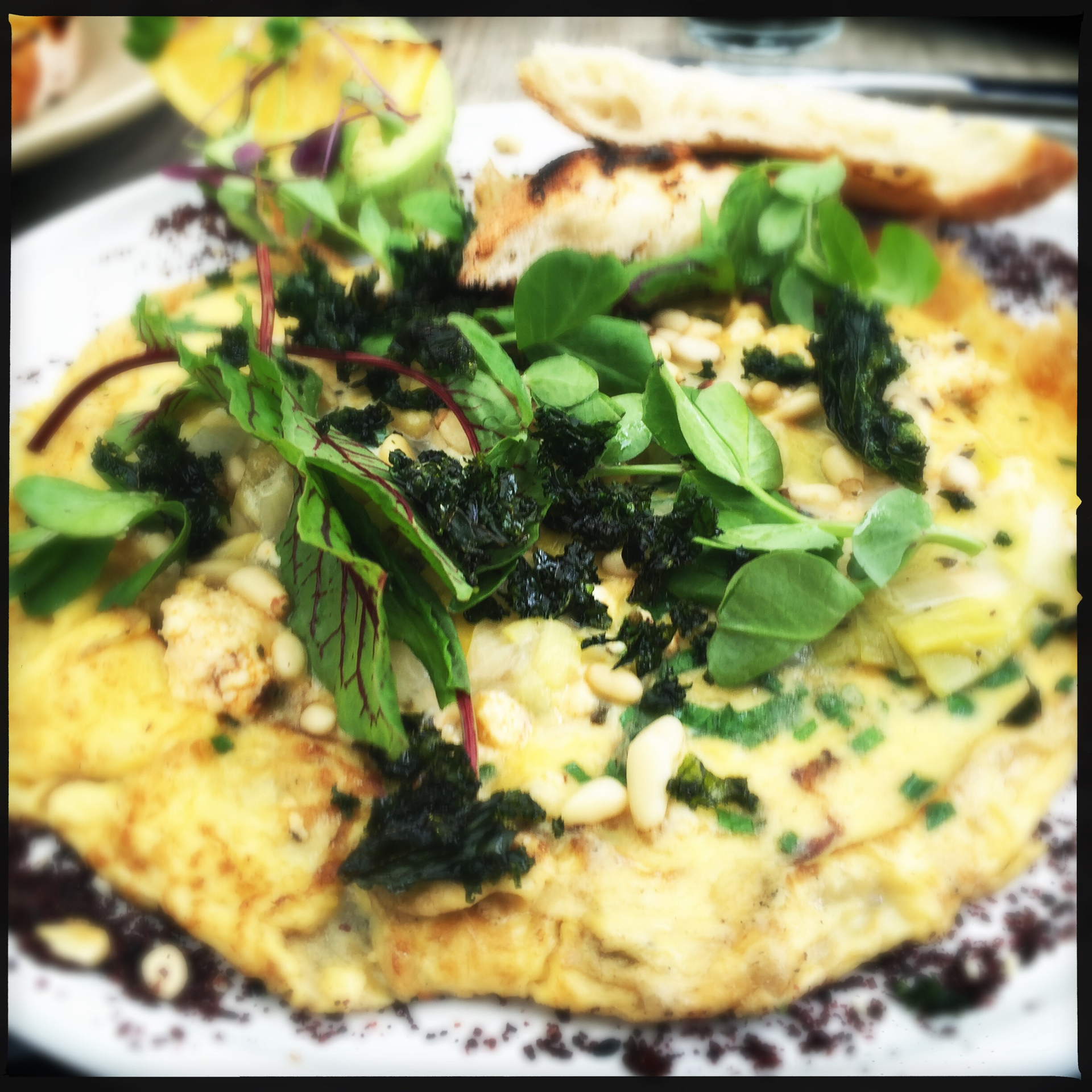 Greek Kalamata Olive and Feta Frittata with Oregano Infusion — Brunch served and photographed from above