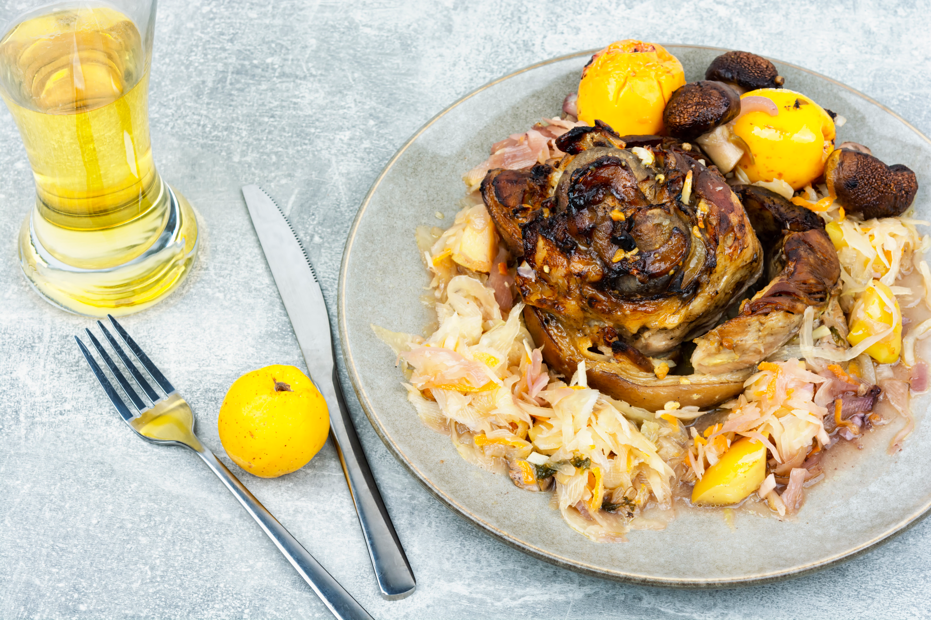 Overhead flat-lay of all ingredients for Greek Kleftiko Lamb with Oregano and Citrus laid out on a kitchen surface.
