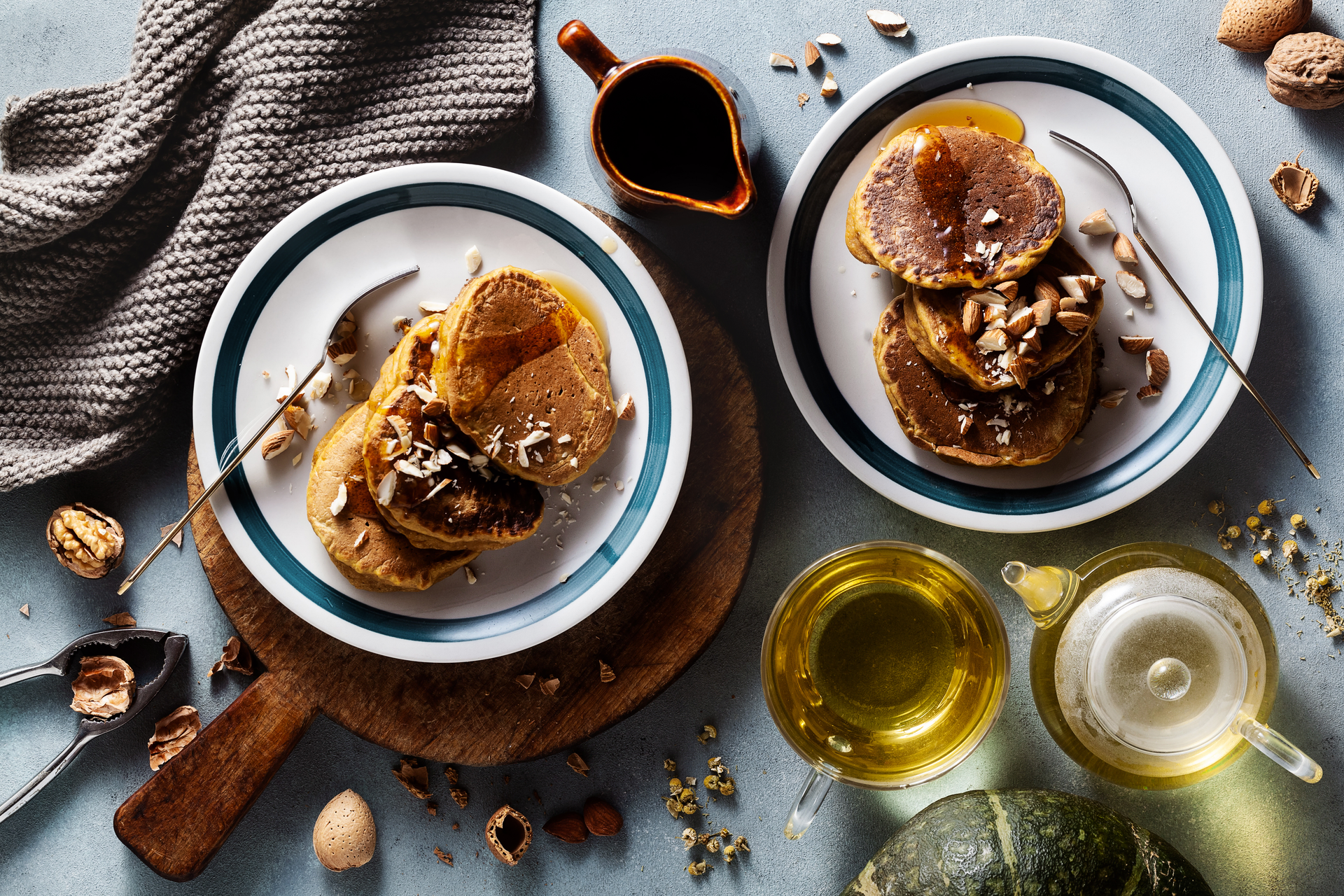 Overhead flat-lay of all ingredients for Greek Loukoumades with Honey Syrup and Walnuts laid out on a kitchen surface.