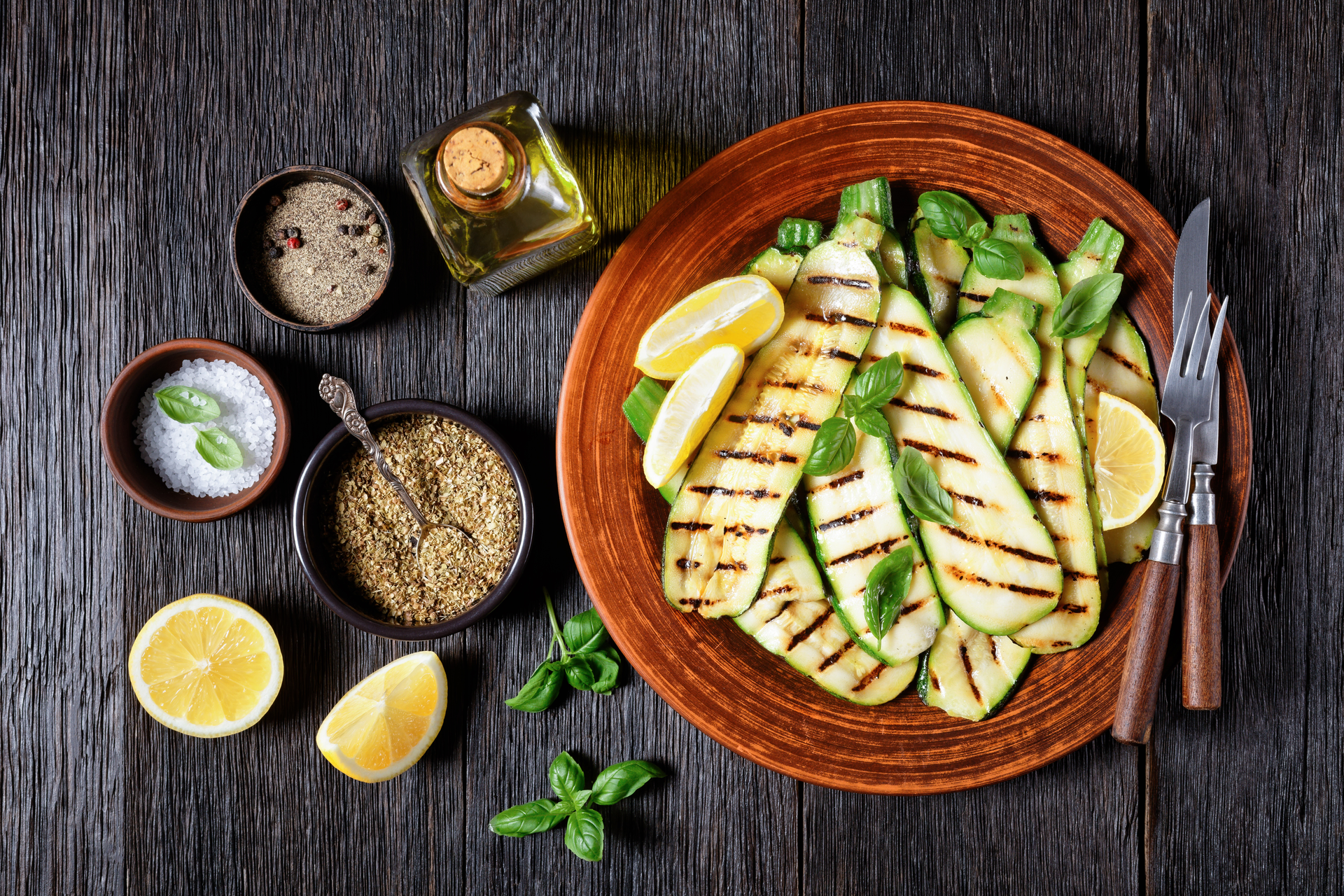 Overhead flat-lay of all ingredients for Grilled Halloumi with Zesty Greek Lemon-Tahini Dressing laid out on a kitchen surface.