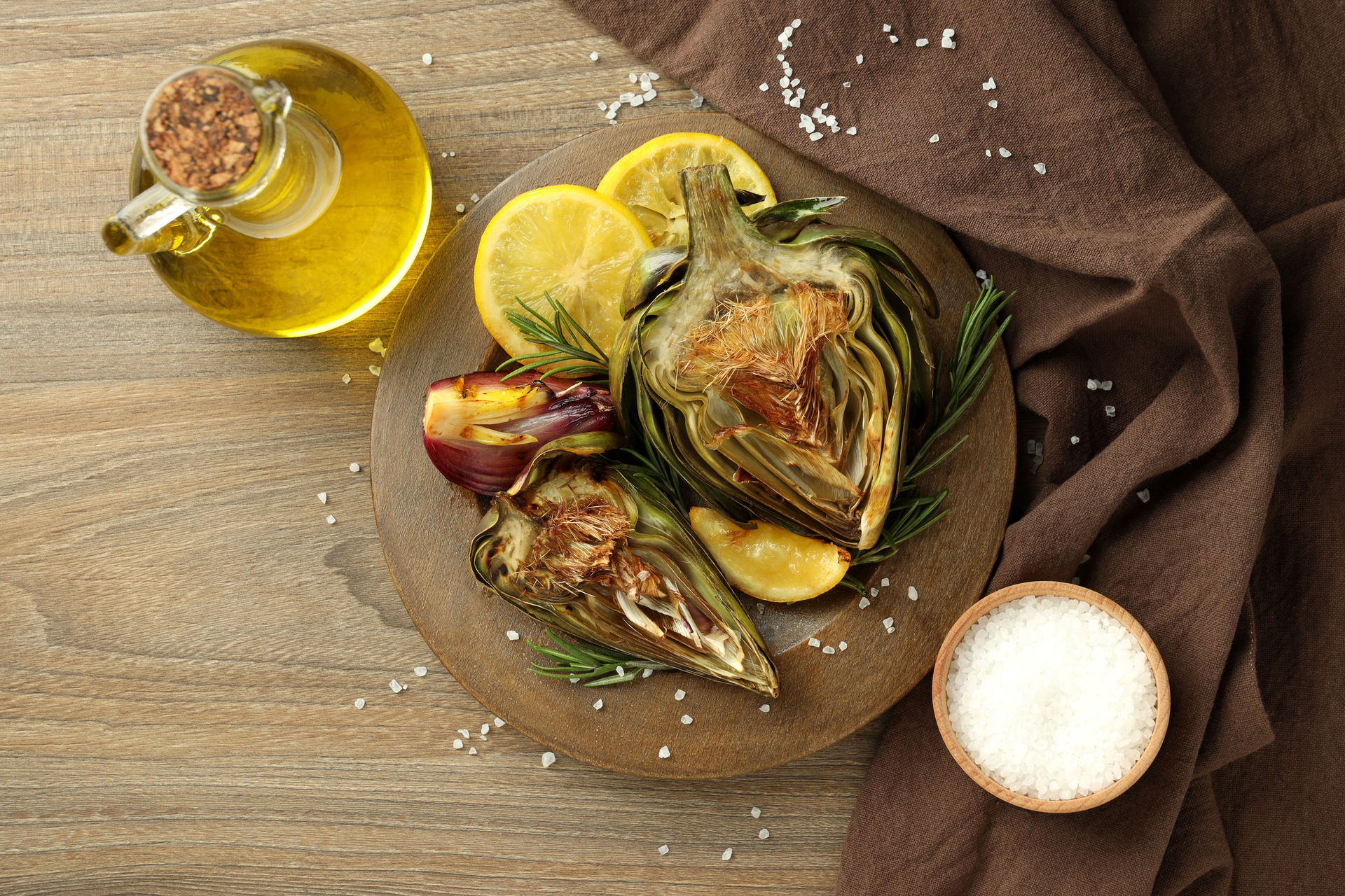 Overhead flat-lay of all ingredients for Grilled Moroccan Chermoula Fish with Preserved Lemons laid out on a kitchen surface.