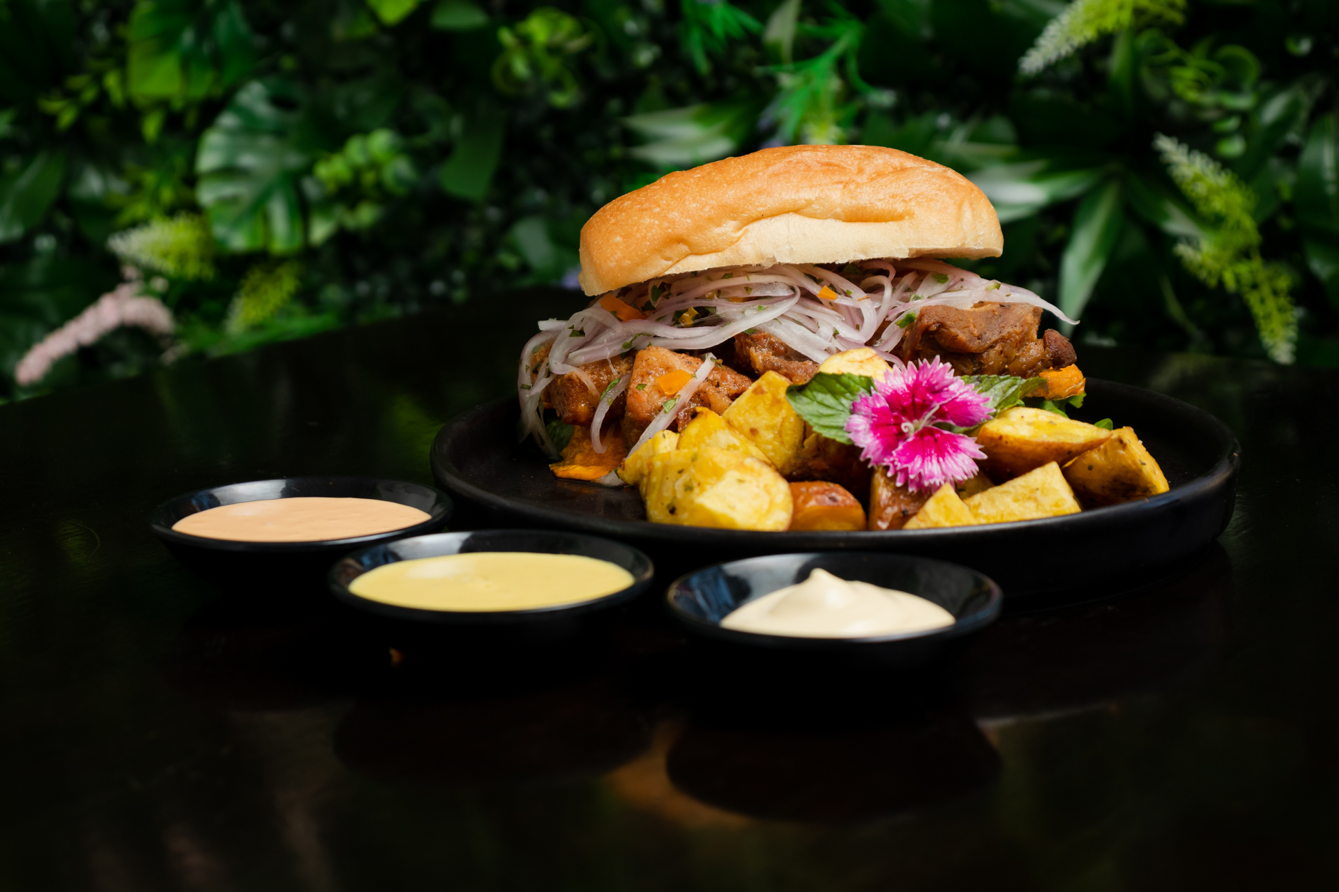Overhead flat-lay of all ingredients for Hawaiian Huli Huli Chicken Sliders with Pineapple Slaw laid out on a kitchen surface.