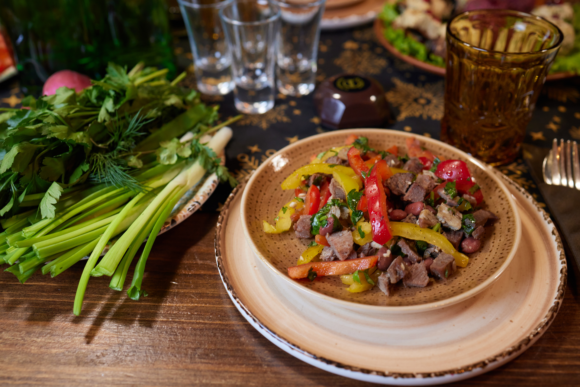 Overhead flat-lay of all ingredients for Hearty Armenian Khashlama with Lamb and Root Vegetables laid out on a kitchen surface.