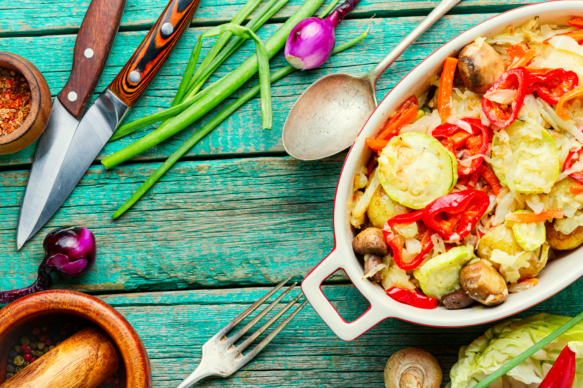Overhead flat-lay of all ingredients for Hearty Belgian Waterzooi with Chicken and Root Vegetables laid out on a kitchen surface.