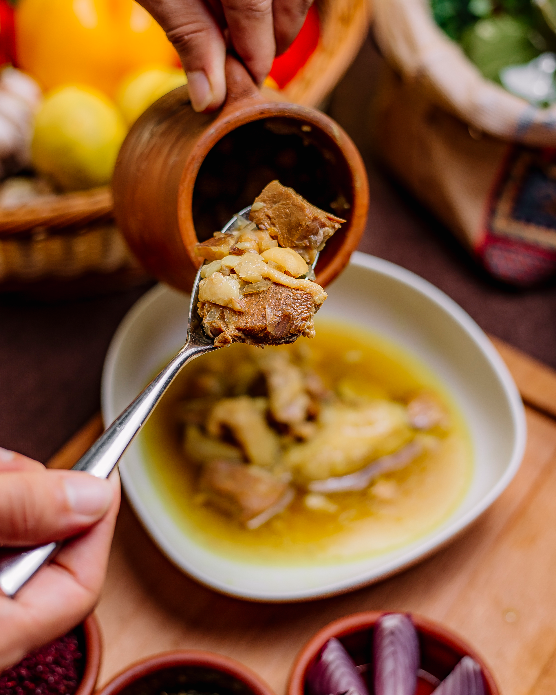 Overhead flat-lay of all ingredients for Hearty Colombian Ajiaco with Guasca Herbs laid out on a kitchen surface.