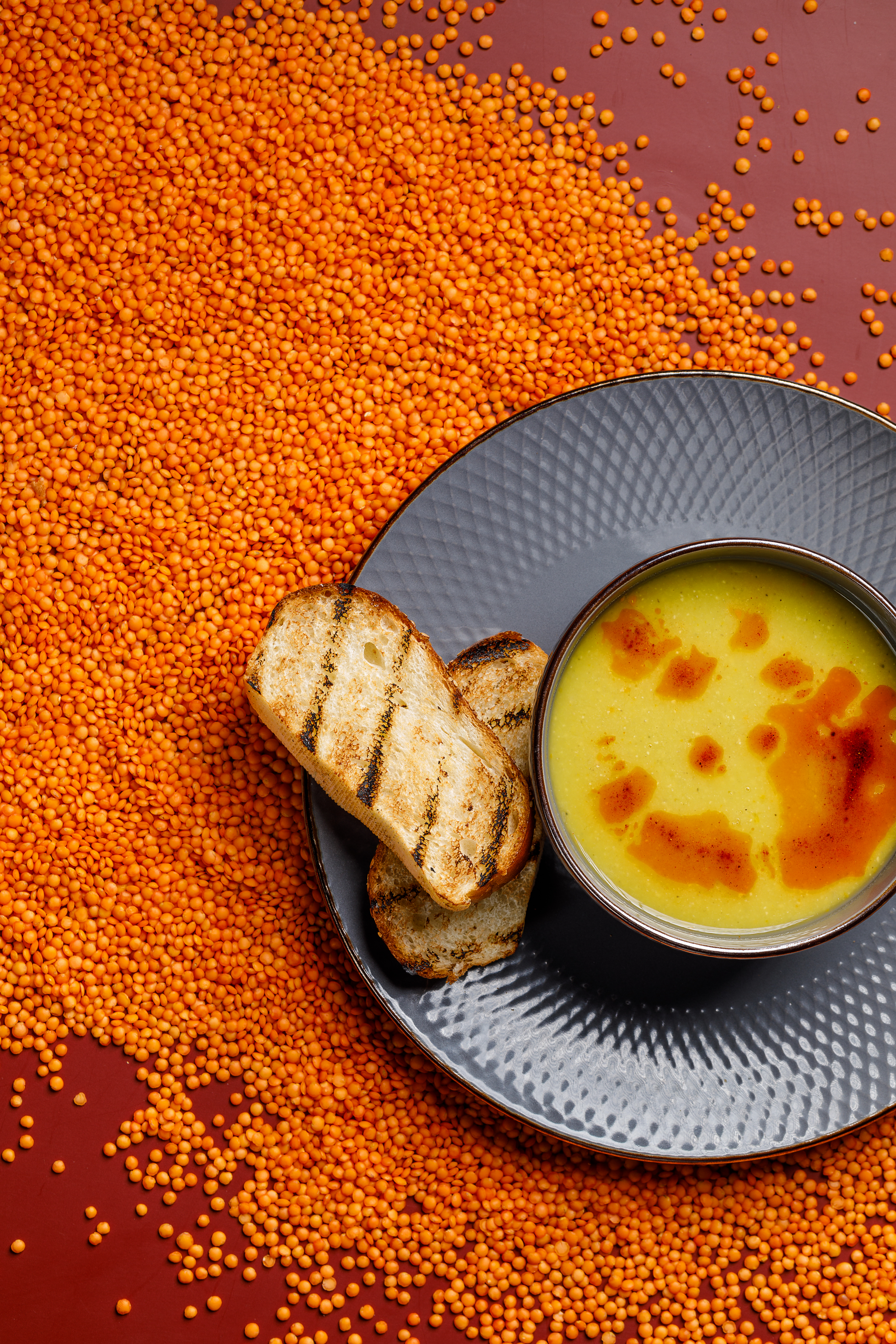 Hearty German Lentil Soup with Frankfurters and Mustard — Soup served and photographed from above
