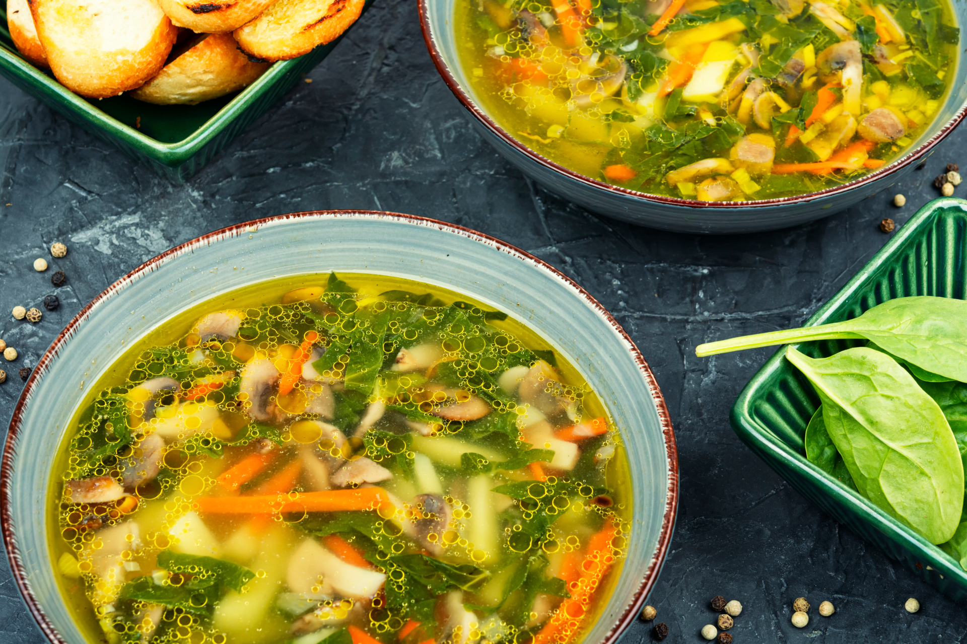 Hearty Ghanaian Peanut Soup with Ginger and Spinach — Soup served and photographed from above