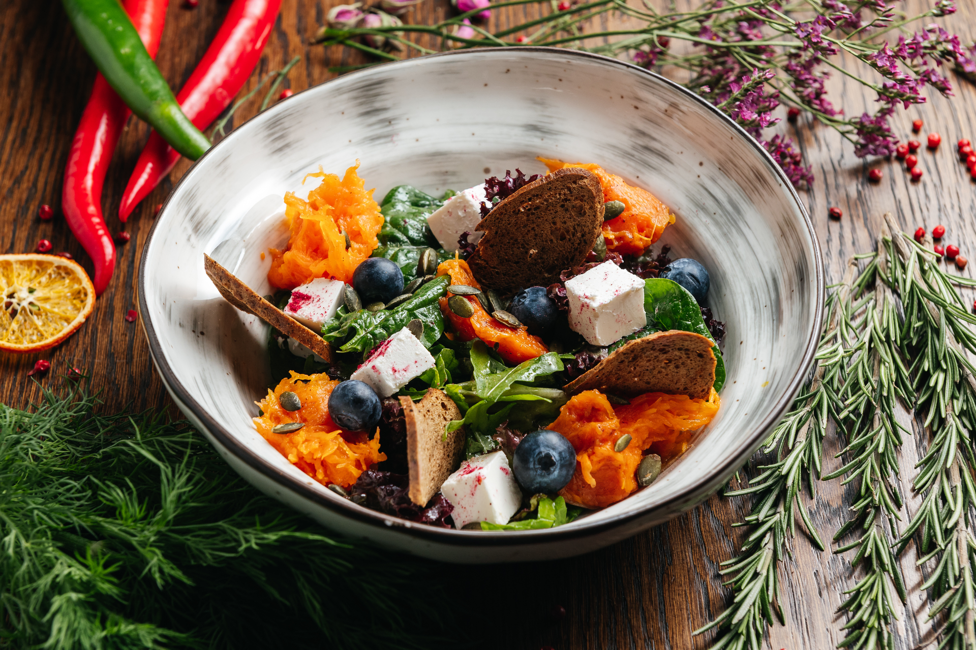 Hearty Greenlandic Muskox Stew with Arctic Herbs — Main Course served and photographed from above