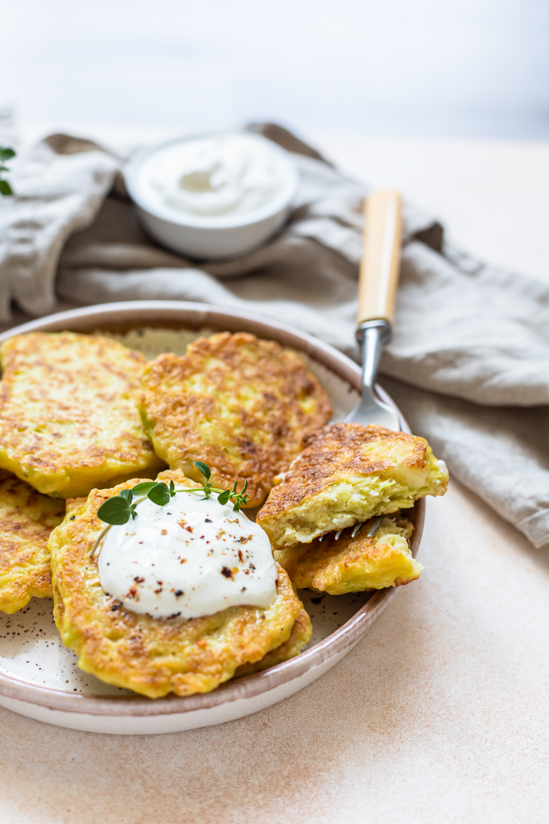 Overhead flat-lay of all ingredients for Hearty Irish Boxty with Sour Cream and Chives laid out on a kitchen surface.