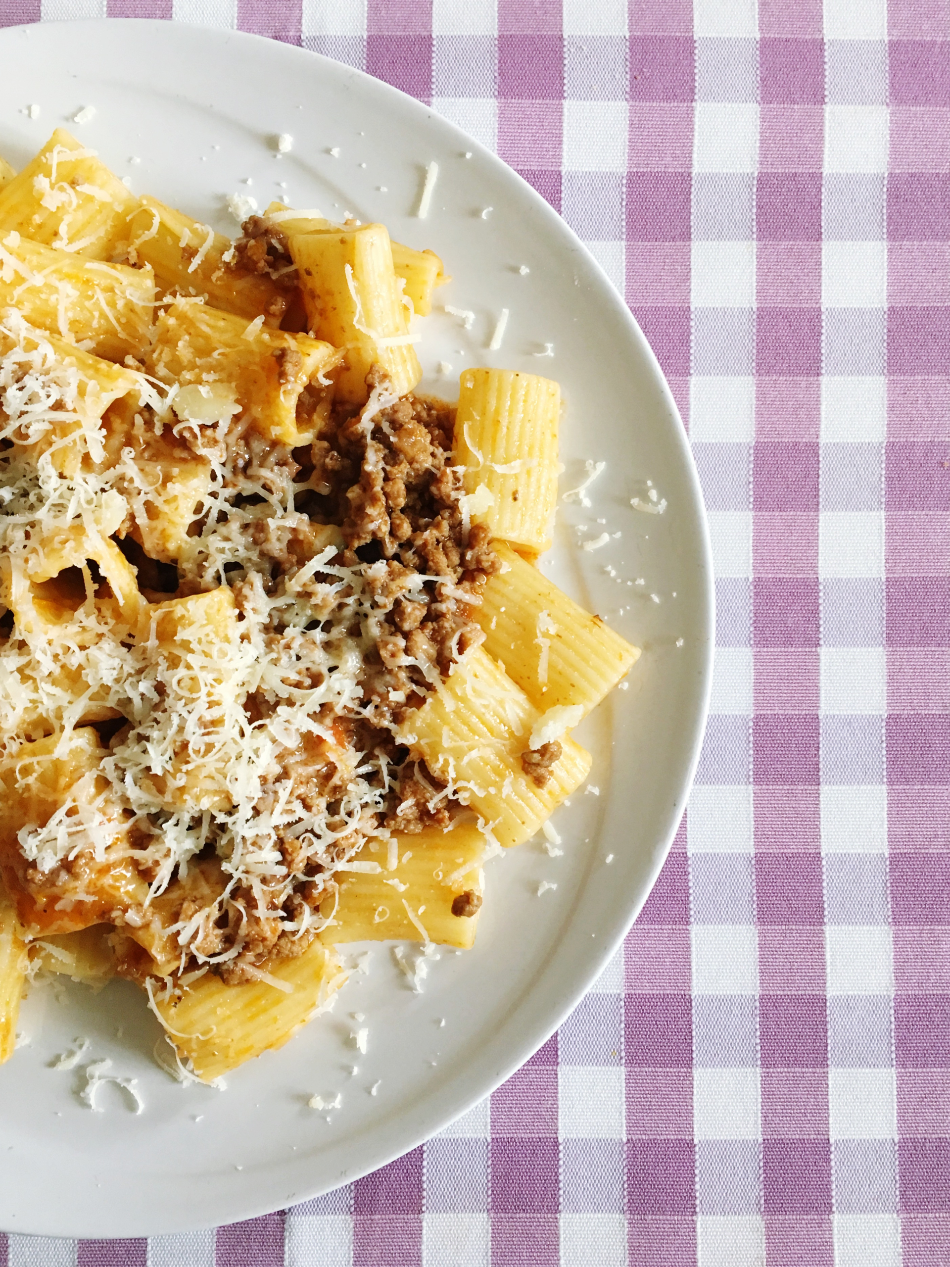 Overhead flat-lay of all ingredients for Hearty Italian Pasta e Fagioli with Parmesan Crisps laid out on a kitchen surface.