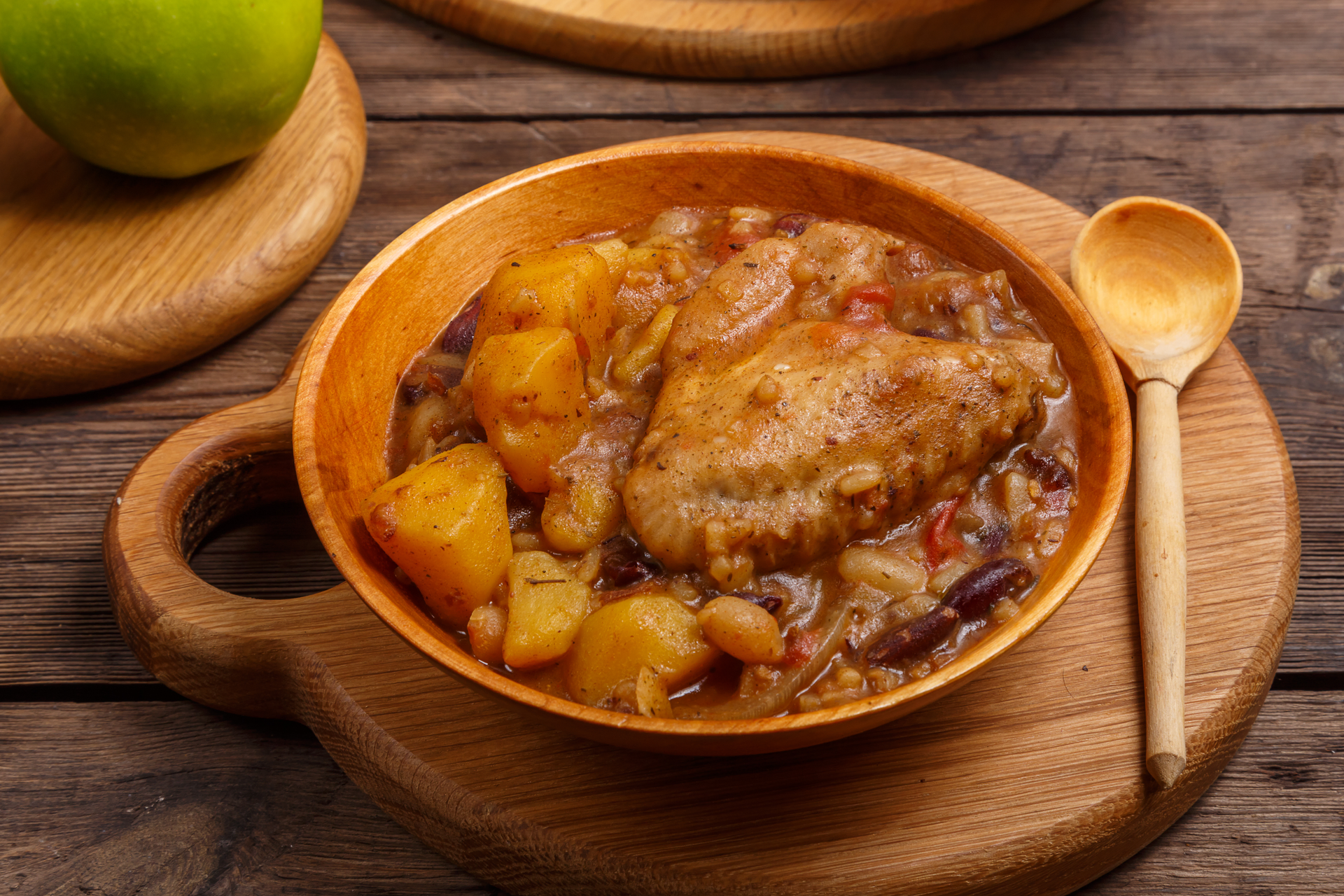 Overhead flat-lay of all ingredients for Hearty Jamaican Ital Stew with Breadfruit laid out on a kitchen surface.