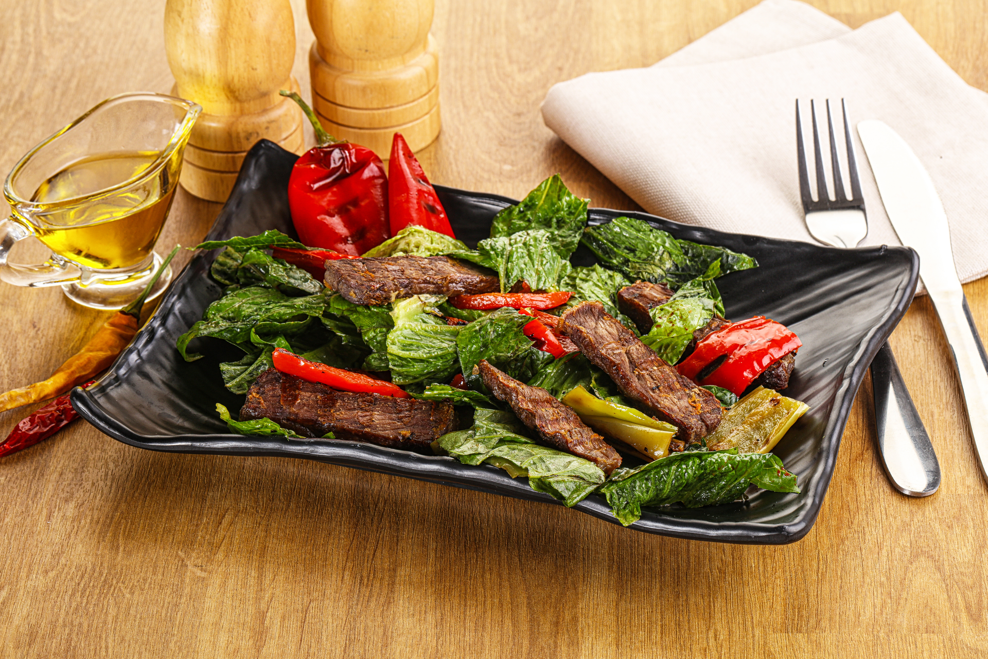 Overhead flat-lay of all ingredients for Hearty Kenyan Nyama Choma with Kachumbari Salad laid out on a kitchen surface.
