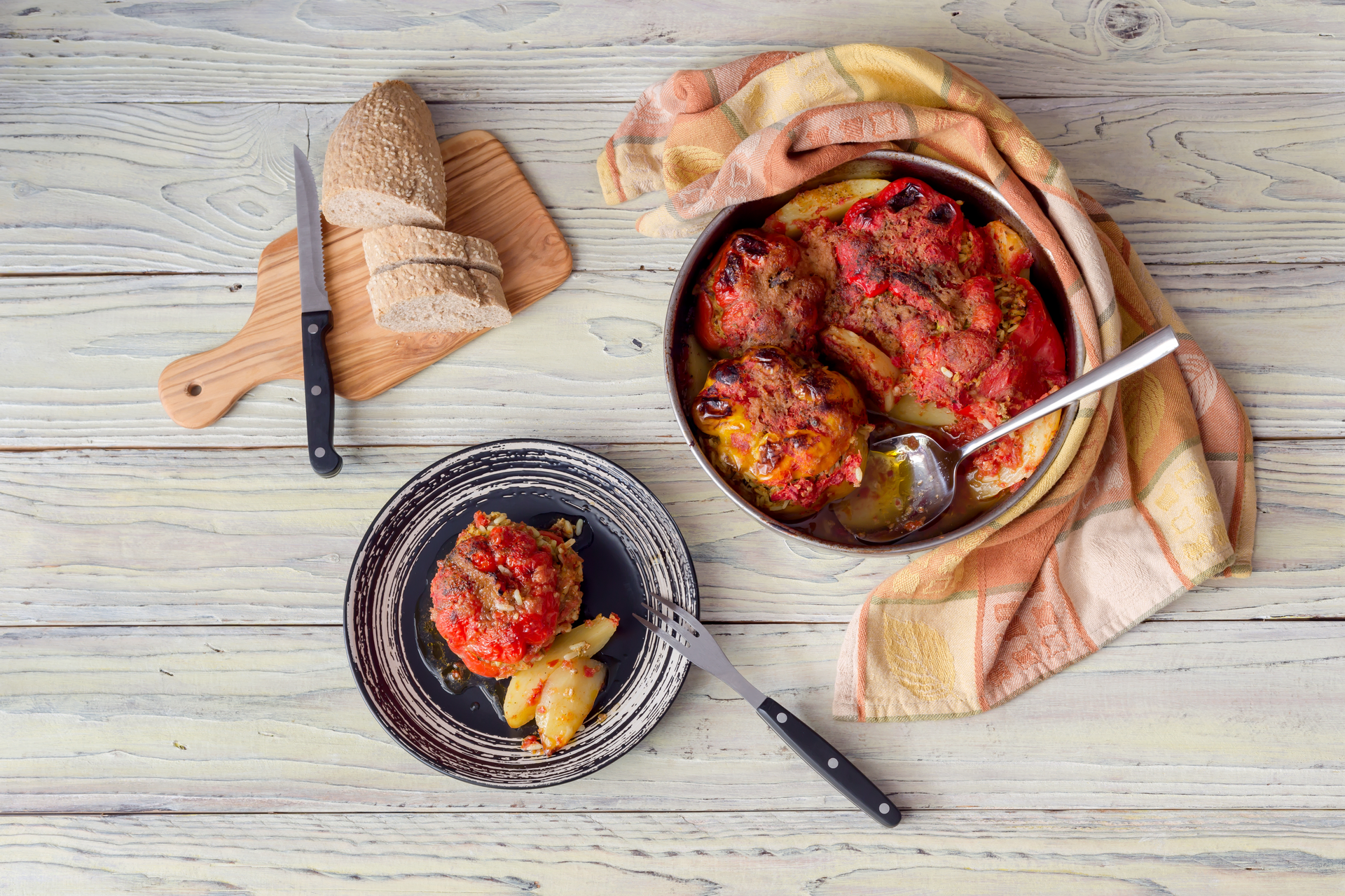 Overhead flat-lay of all ingredients for Hearty Moroccan Kefta Tagine with Tomatoes and Eggs laid out on a kitchen surface.