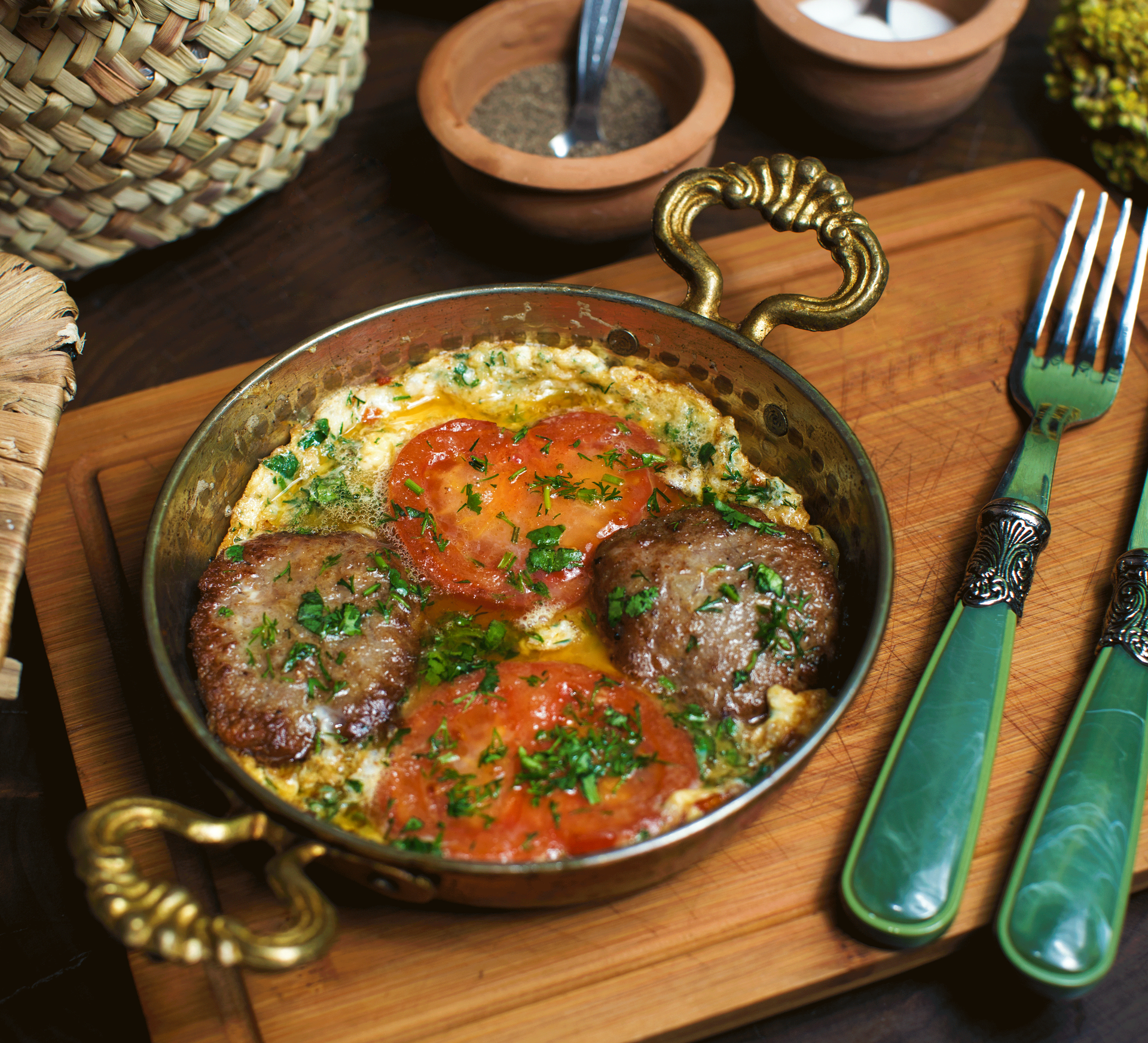 Hearty Moroccan Kefta Tagine with Tomatoes and Eggs — Main Course served and photographed from above