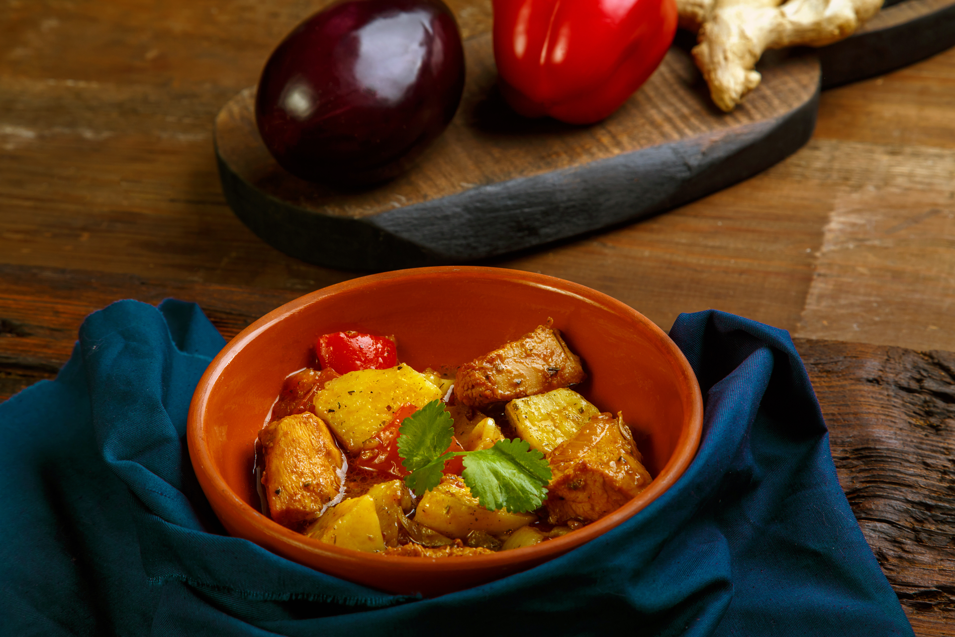 Overhead flat-lay of all ingredients for Hearty Peruvian Adobo with Potatoes and Aji Amarillo laid out on a kitchen surface.