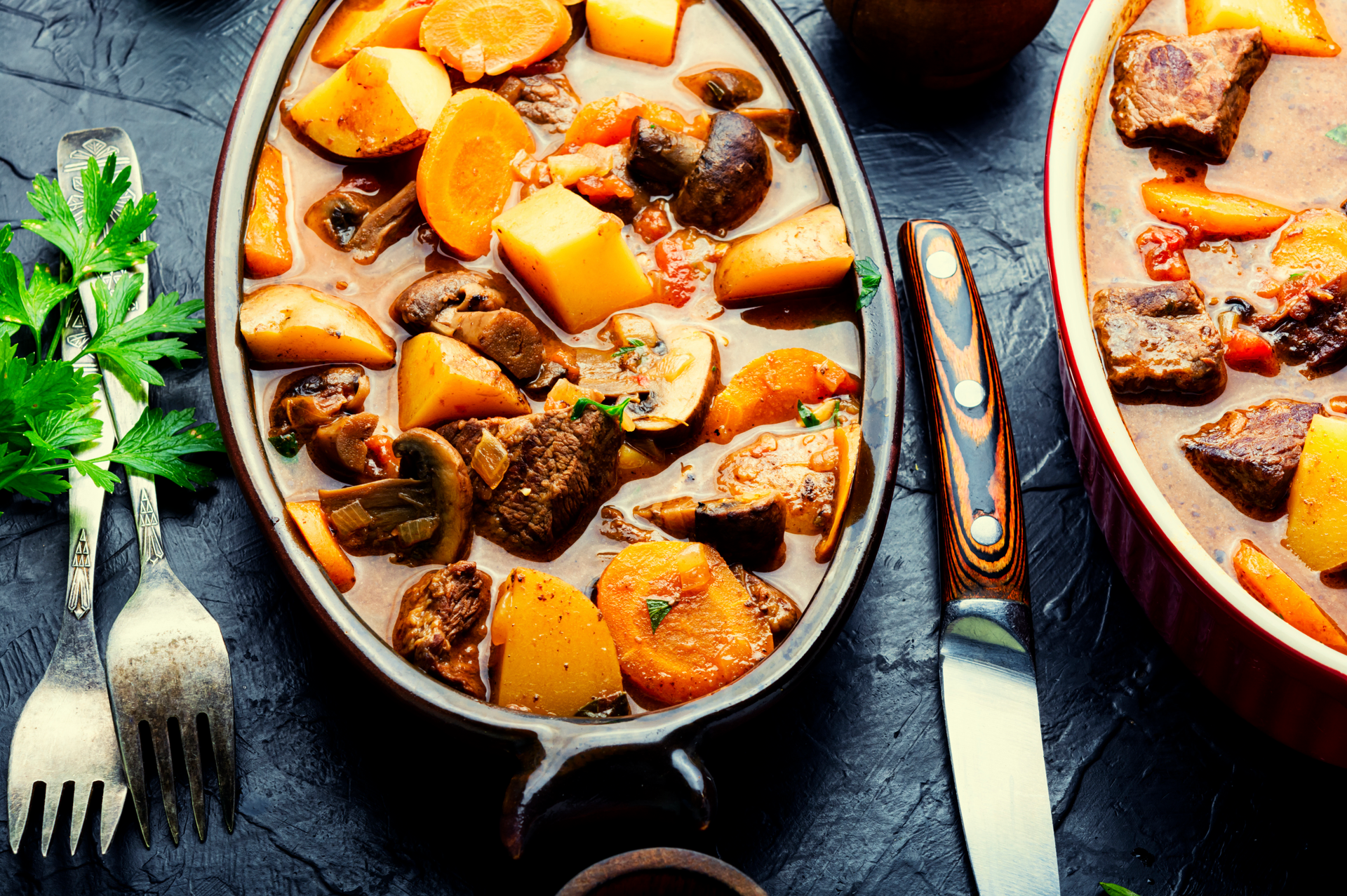 Overhead flat-lay of all ingredients for Hearty Welsh Cawl with Lamb and Root Vegetables laid out on a kitchen surface.