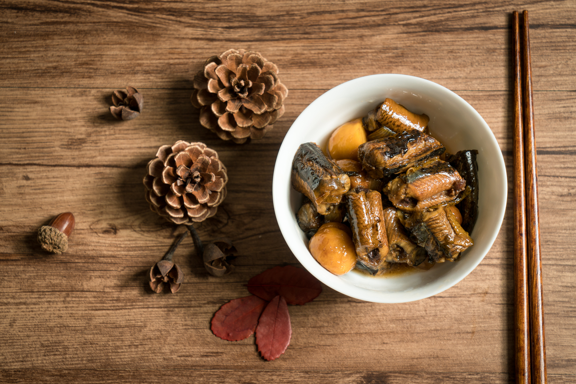 Overhead flat-lay of all ingredients for Heavenly Korean Ginseng Chicken Stew with Jujube and Pine Nuts laid out on a kitchen surface.