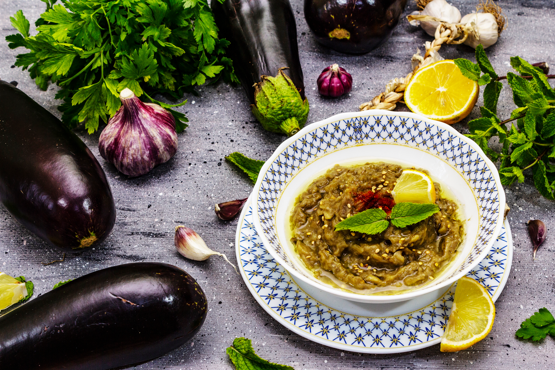 Overhead flat-lay of all ingredients for Herb-Infused Afghan Vegetable Mantoo with Cilantro Chutney laid out on a kitchen surface.