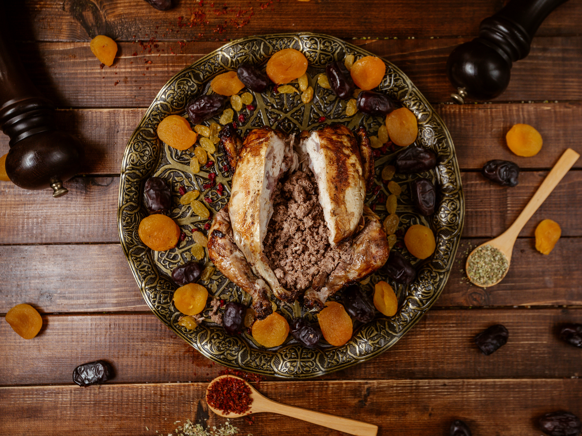 Overhead flat-lay of all ingredients for Herb-Infused Arabic Mansaf with Lamb and Pine Nuts laid out on a kitchen surface.