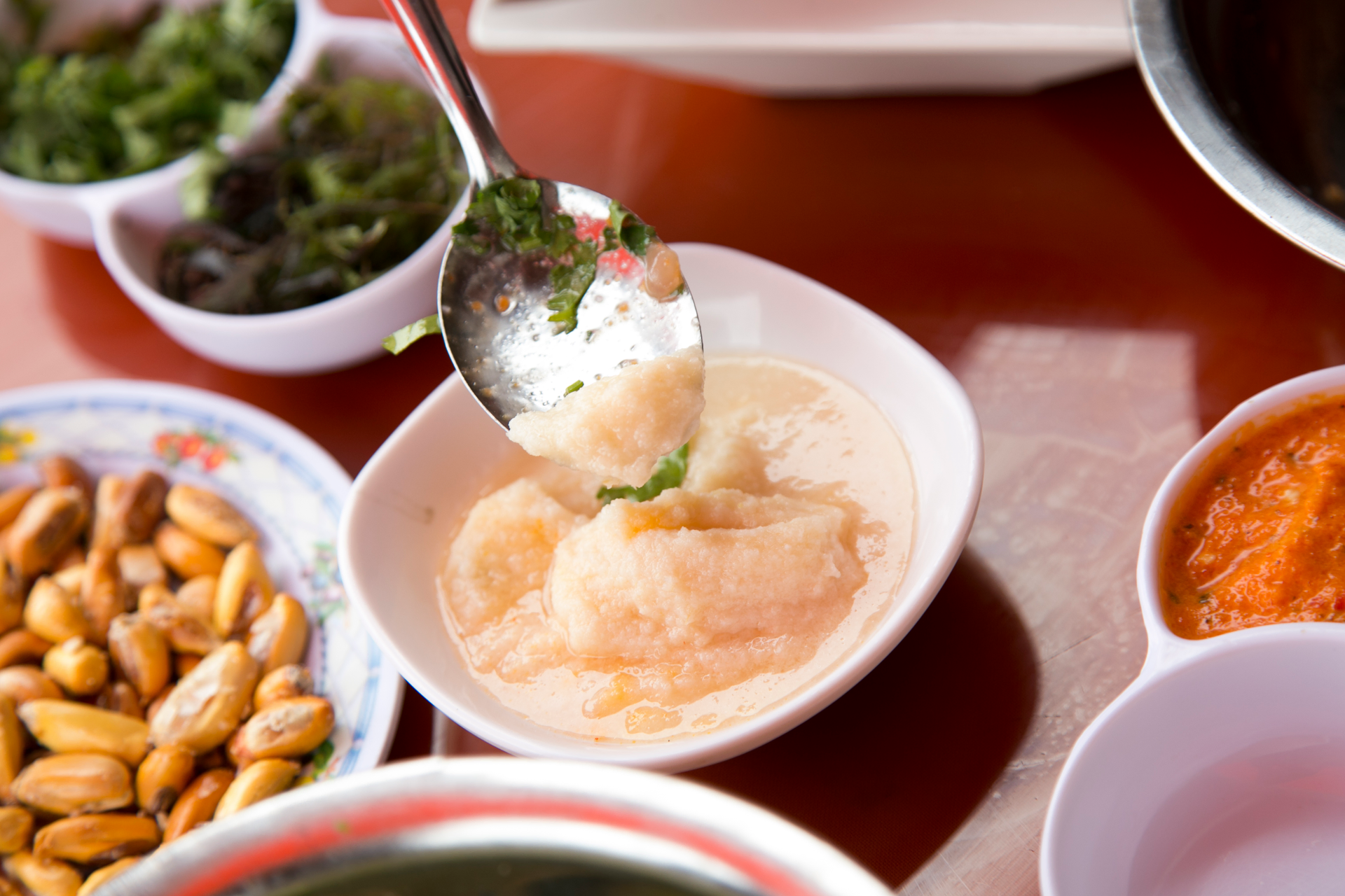 Herb-Infused Thai Cha Yentafo with Fermented Bean Curd Sauce — Soup served and photographed from above