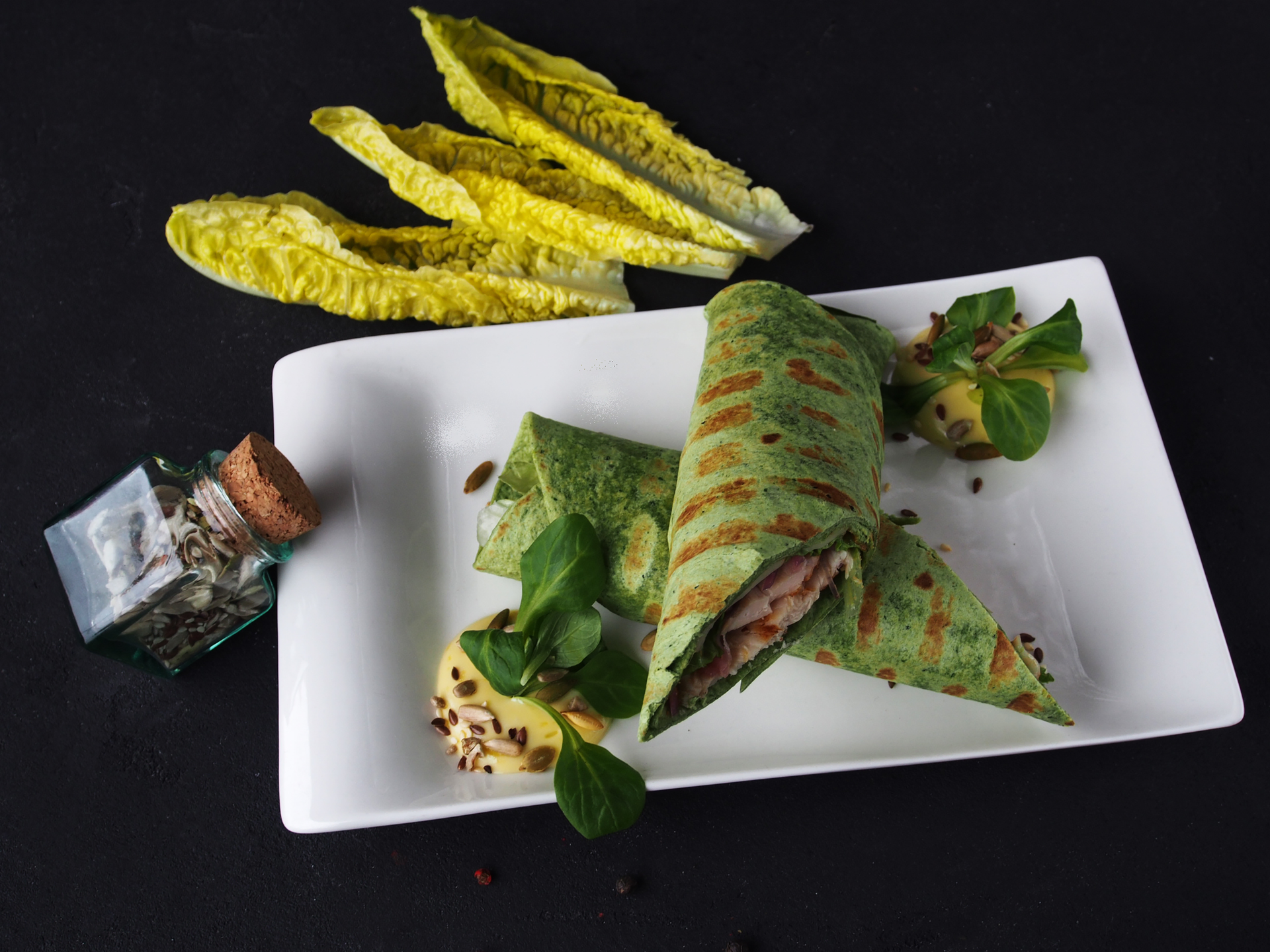 Overhead flat-lay of all ingredients for Herbaceous Ethiopian Misir Wot Wrap with Injera laid out on a kitchen surface.
