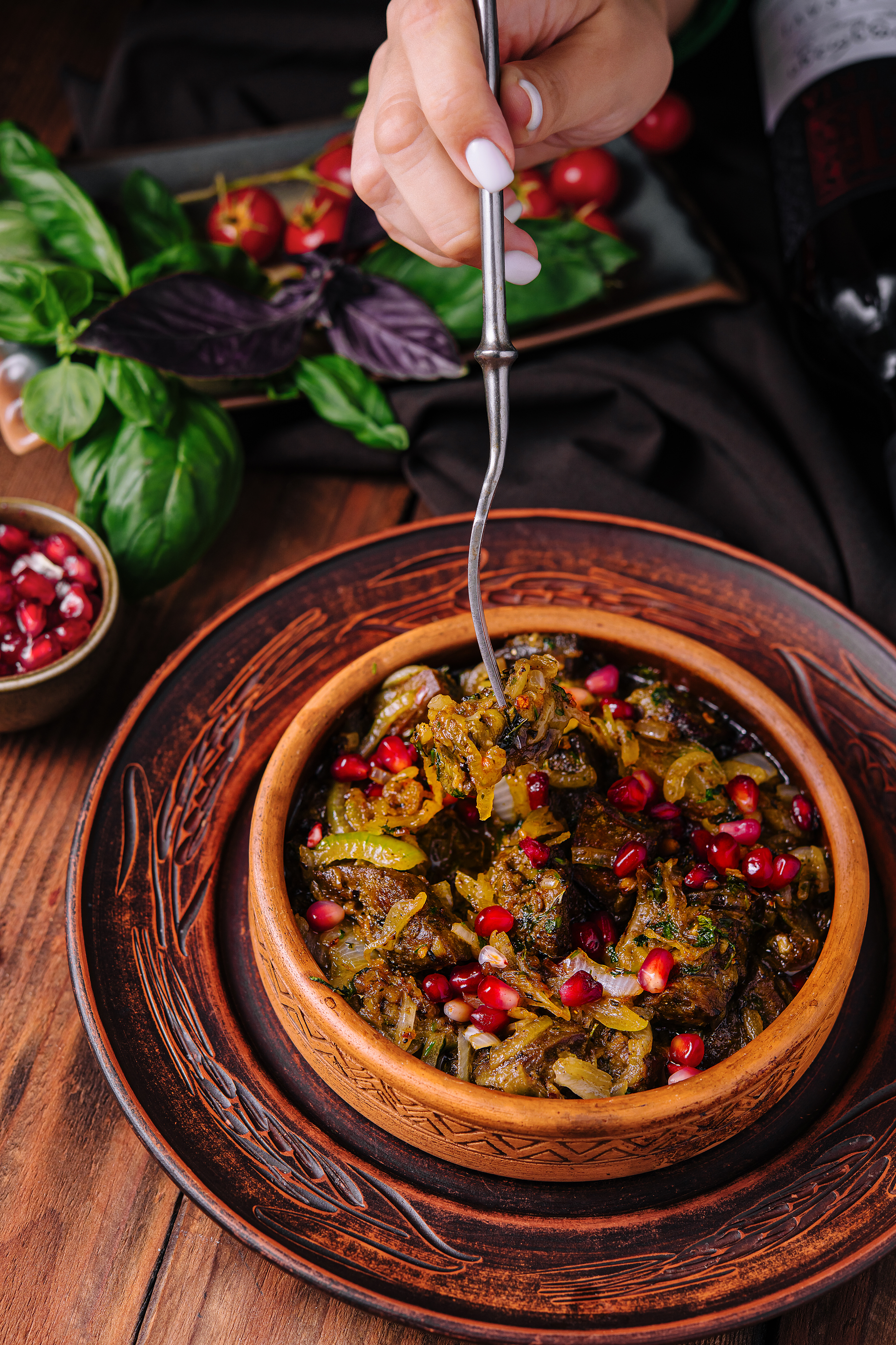Overhead flat-lay of all ingredients for Herbaceous Iranian Kuku Sabzi with Walnuts and Barberries laid out on a kitchen surface.