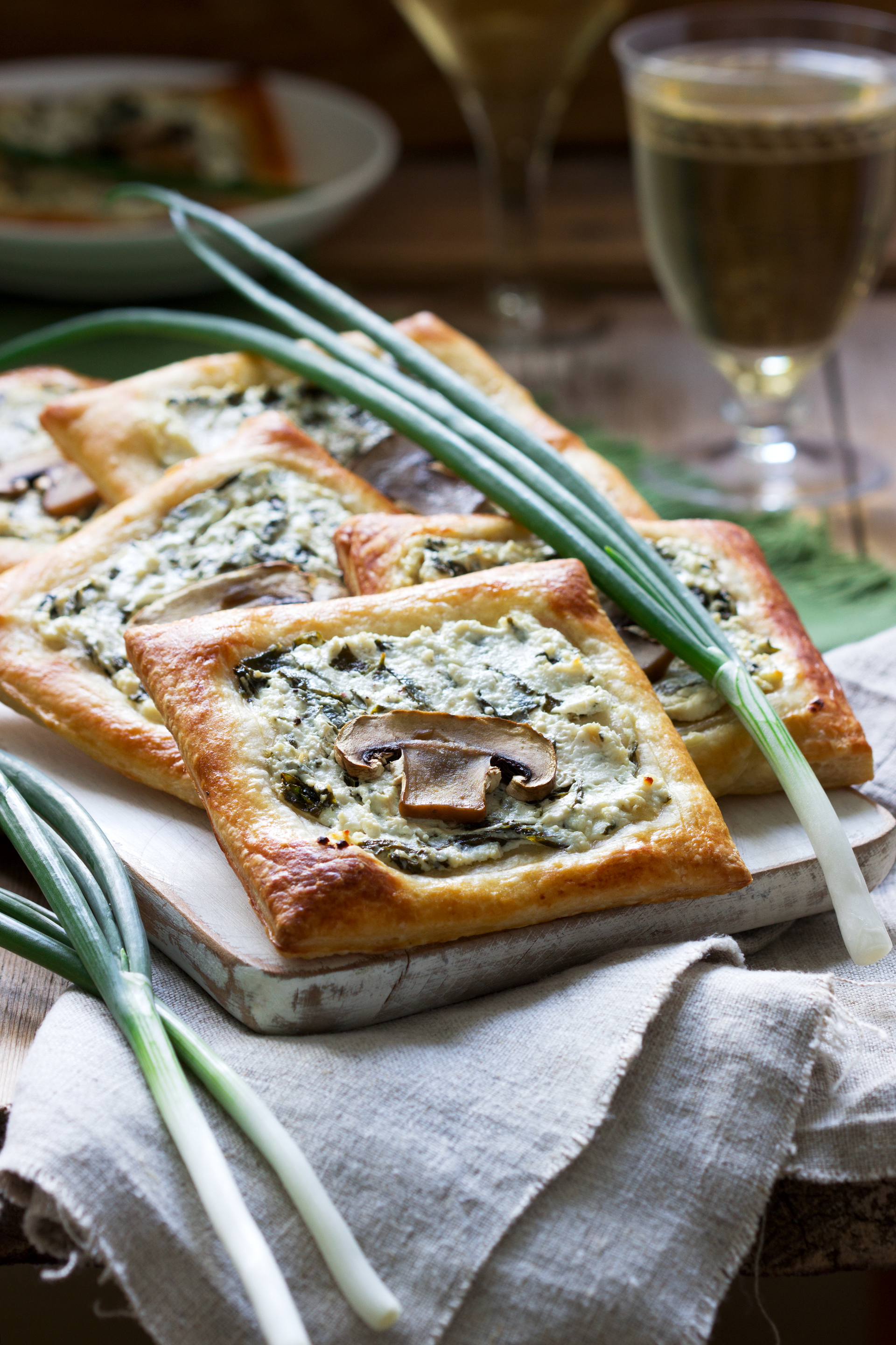 Overhead flat-lay of all ingredients for Herbaceous Italian Focaccia with Rosemary and Sea Salt laid out on a kitchen surface.