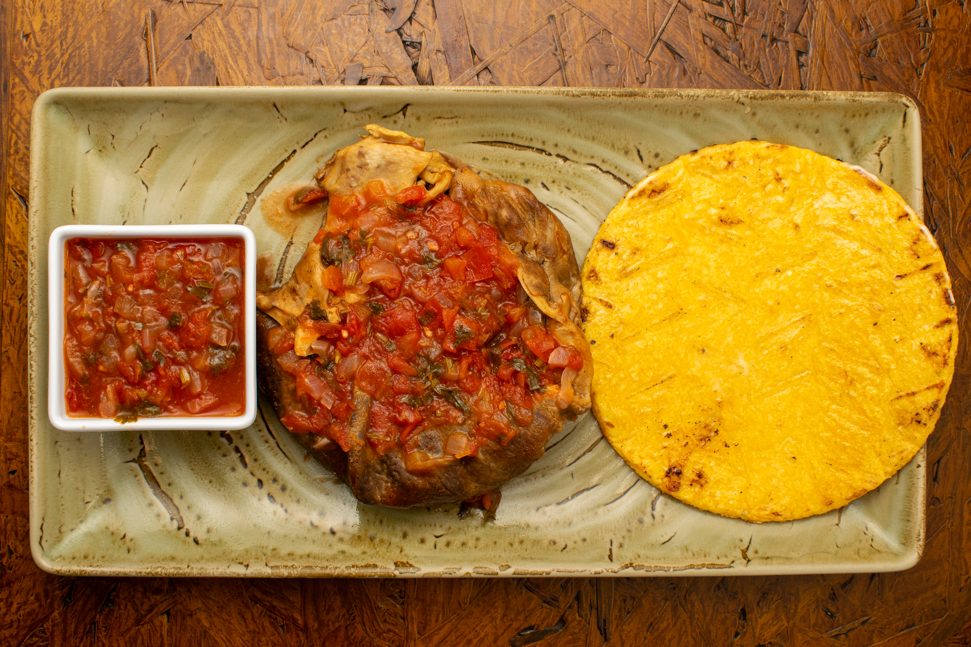 Overhead flat-lay of all ingredients for Honduran Lenca Pupusas with Chorizo and Spicy Curtido laid out on a kitchen surface.