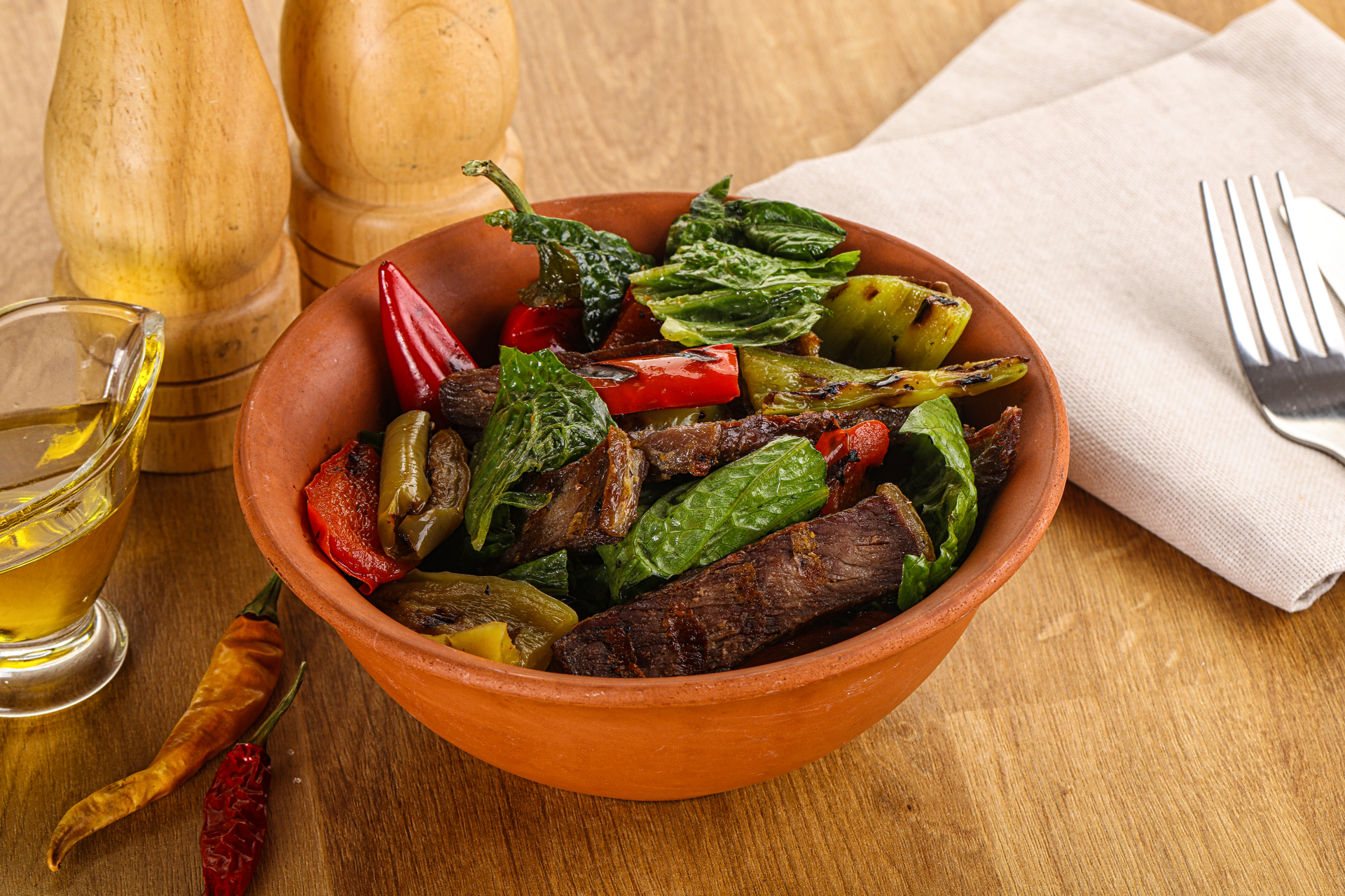 Overhead flat-lay of all ingredients for Honey-Balsamic Ethiopian Doro Tibs with Vegetables laid out on a kitchen surface.