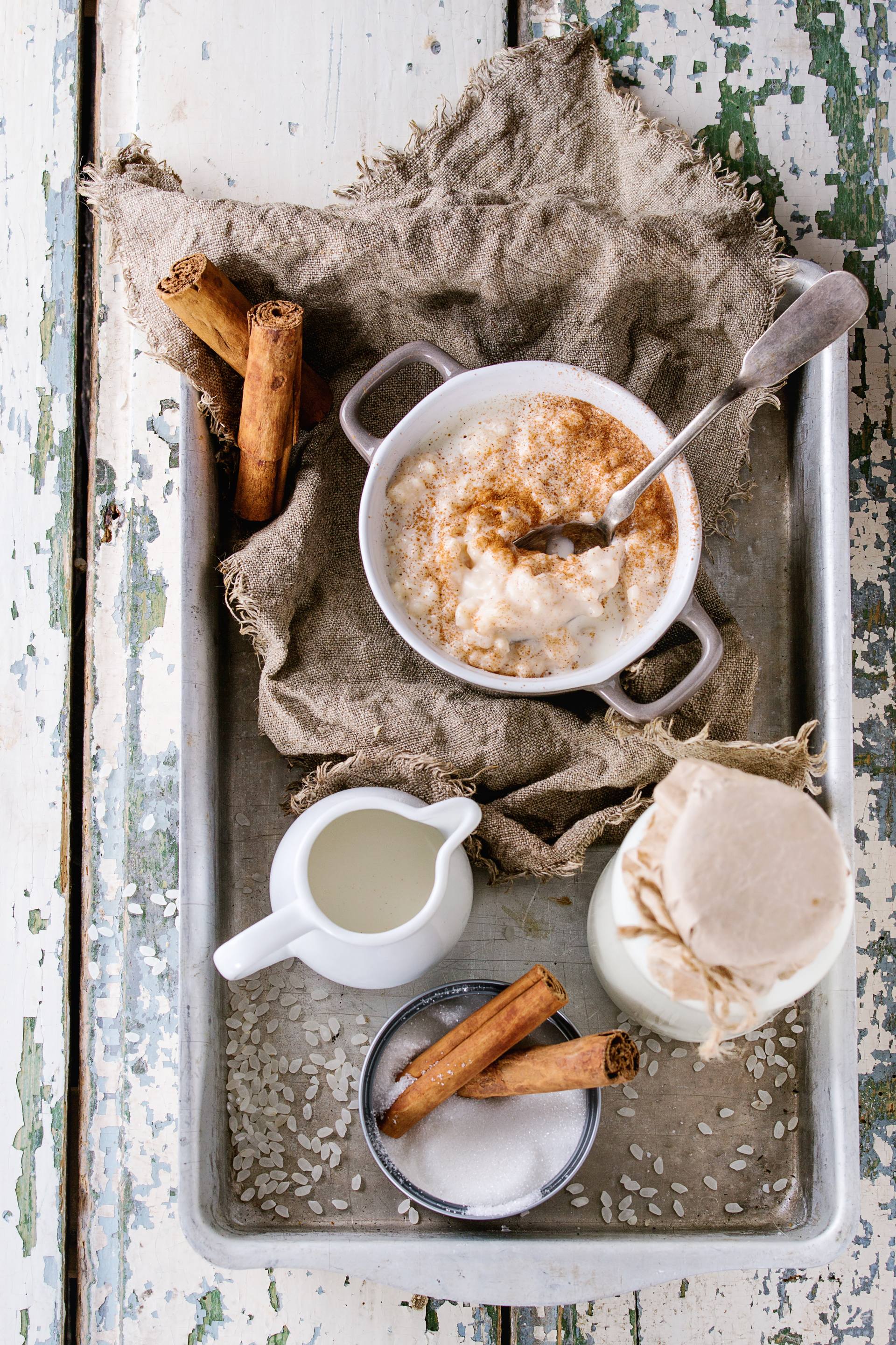 Honey-Glazed Norwegian Rømmegrøt with Butter and Cinnamon — Dessert served and photographed from above