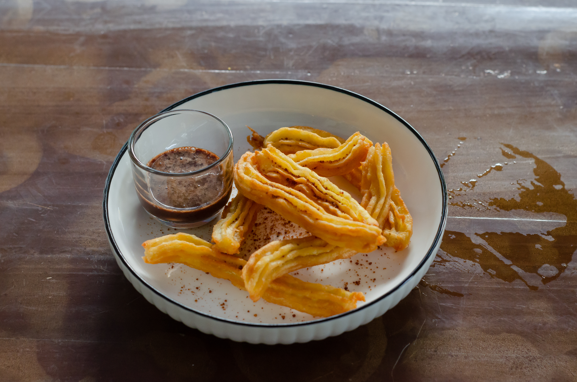 Overhead flat-lay of all ingredients for Honey-Lemon Spanish Churros with Whipped Cream laid out on a kitchen surface.