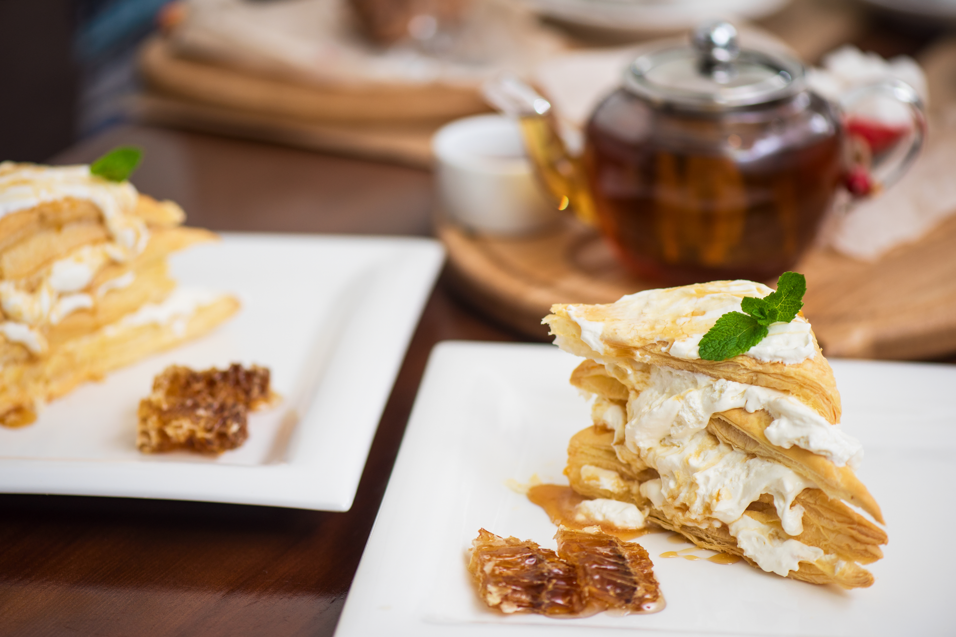 Overhead flat-lay of all ingredients for Honeyed Greek Baklava Crepes with Vanilla Yogurt Filling laid out on a kitchen surface.