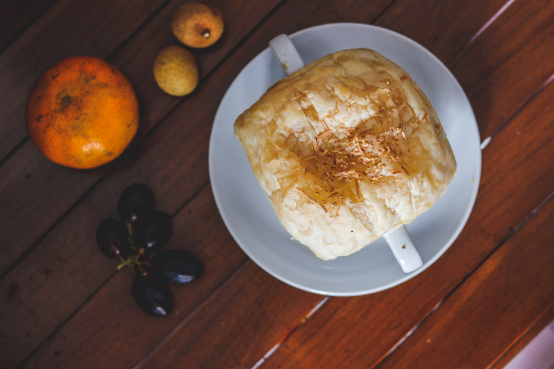 Overhead flat-lay of all ingredients for Hungarian Apricot Jam-filled Palacsinta with Powdered Sugar laid out on a kitchen surface.