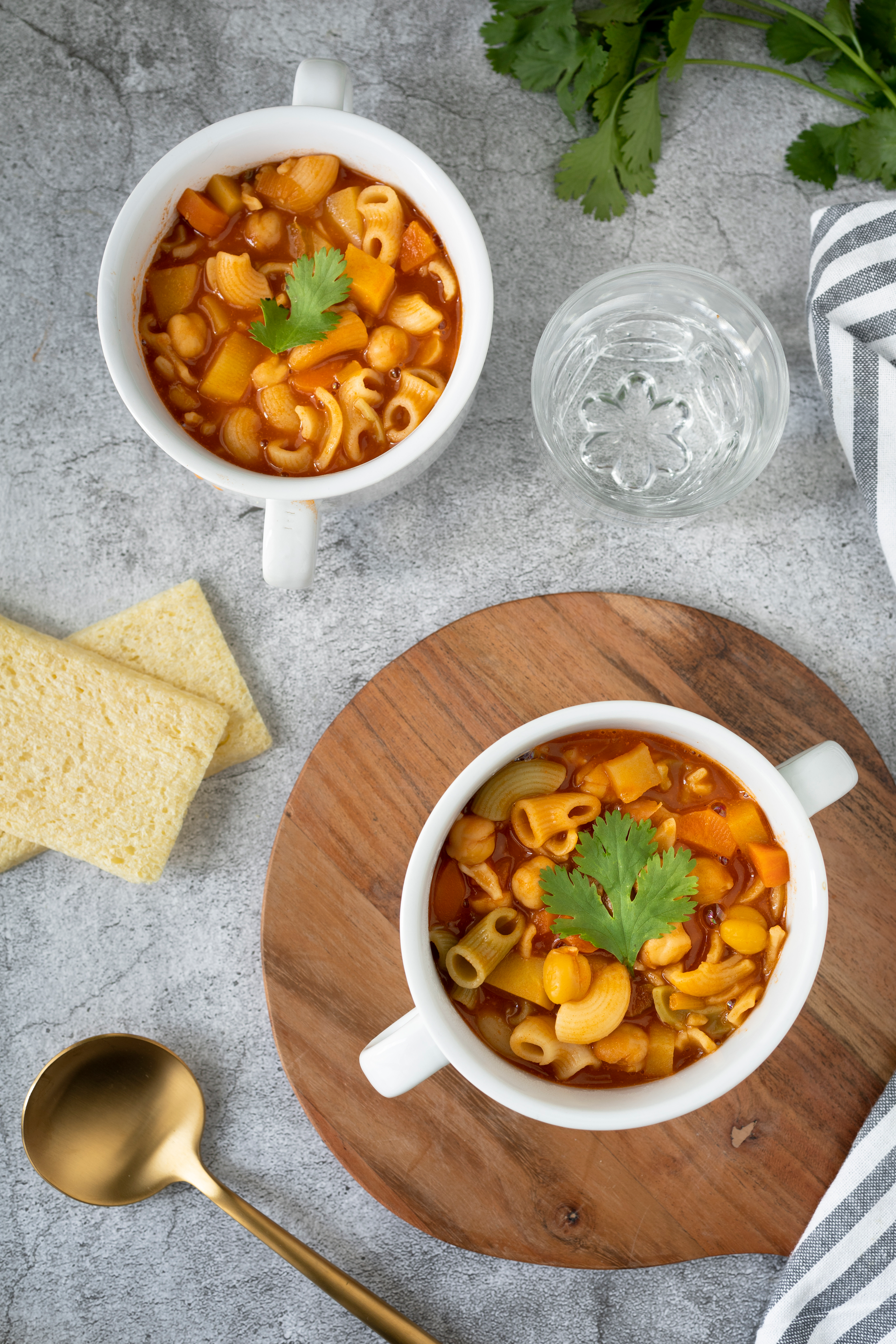 Overhead flat-lay of all ingredients for Hungarian Goulash with Paprika and Noodles laid out on a kitchen surface.
