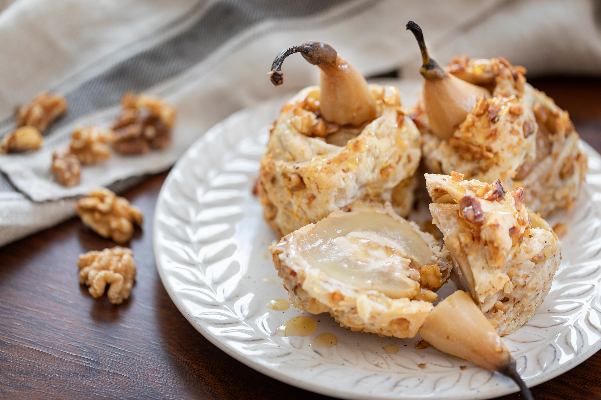 Overhead flat-lay of all ingredients for Hungarian Walnut Honey Cake with Truffle Cream laid out on a kitchen surface.