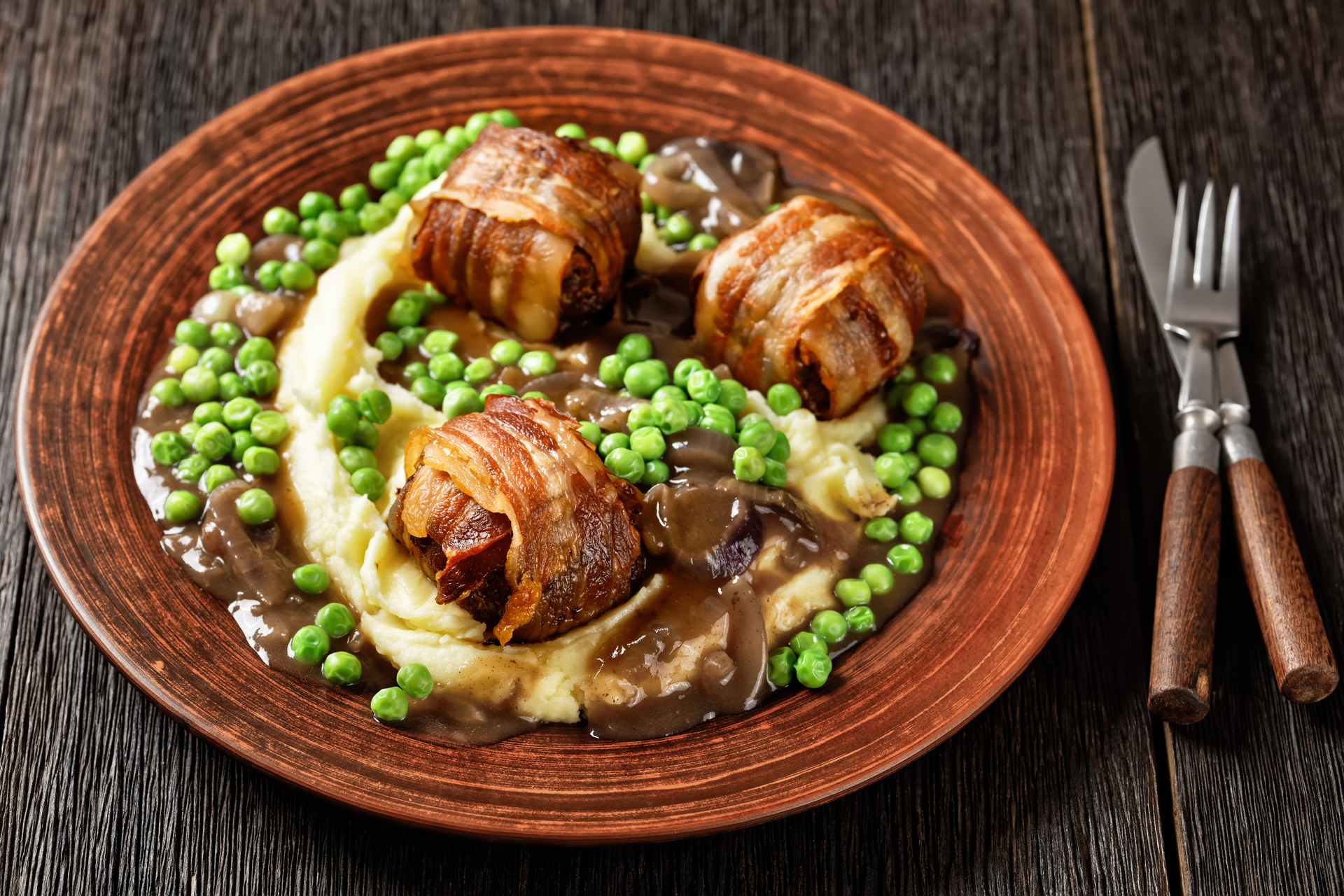 Overhead flat-lay of all ingredients for Icelandic Hangikjöt with Peas and Bechamel Sauce laid out on a kitchen surface.