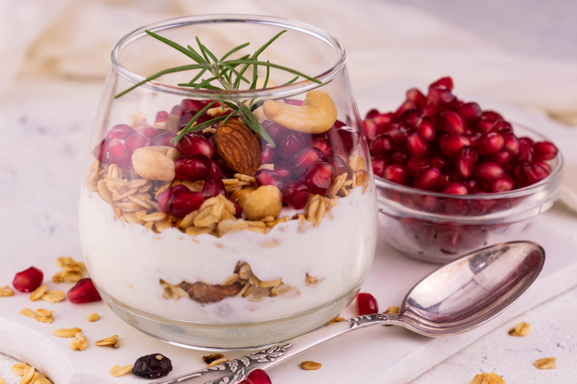 Overhead flat-lay of all ingredients for Icelandic Skyr Honey Parfait with Walnut and Lingonberries Topping laid out on a kitchen surface.
