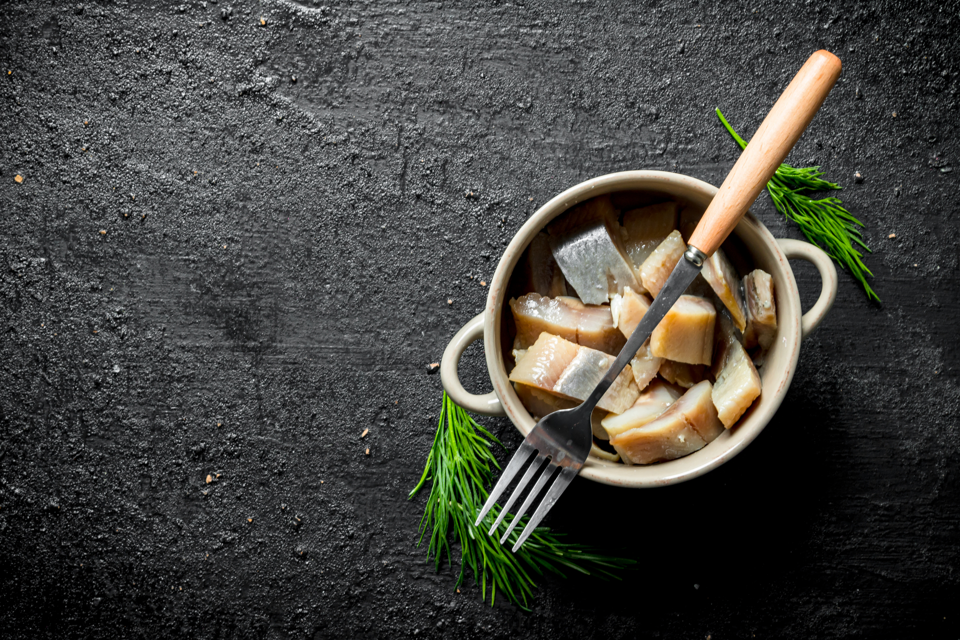 Overhead flat-lay of all ingredients for Icelandic Spicy Fish Stew with Seaweed laid out on a kitchen surface.