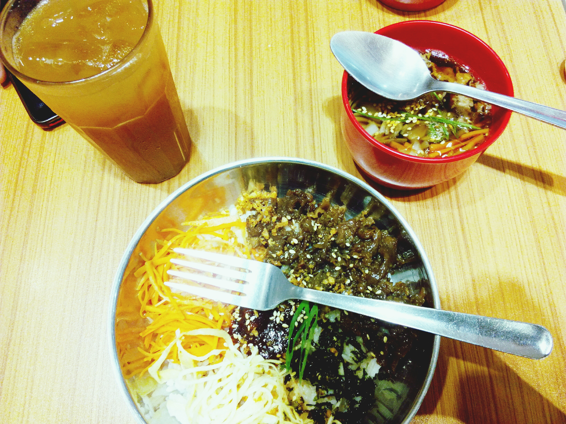 Overhead flat-lay of all ingredients for Indian Tamarind Lentil Ramen with Curry Leaf Oil laid out on a kitchen surface.