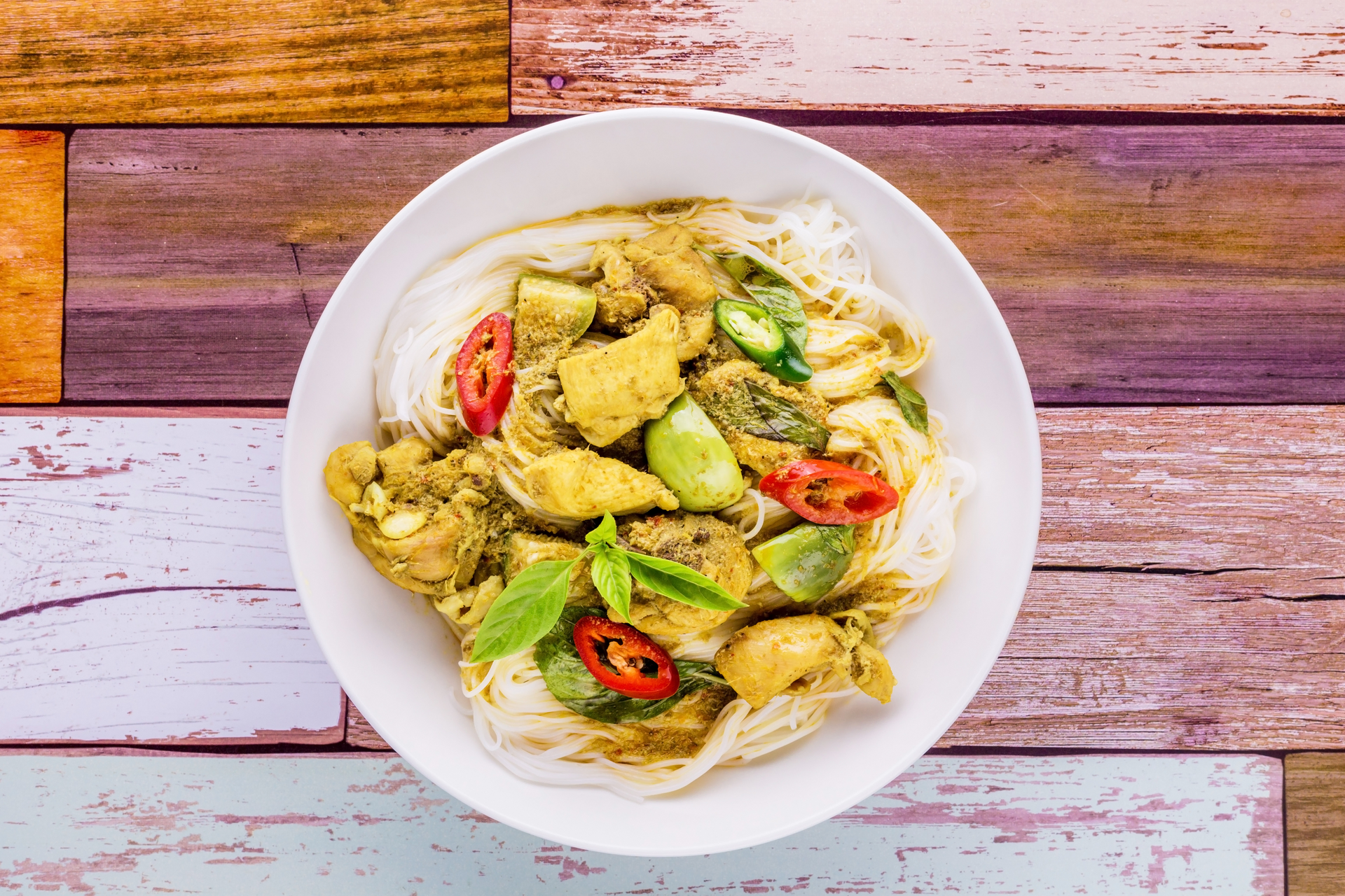 Overhead flat-lay of all ingredients for Indonesian Gado-Gado Bowl with Spicy Peanut Sauce and Tempeh laid out on a kitchen surface.