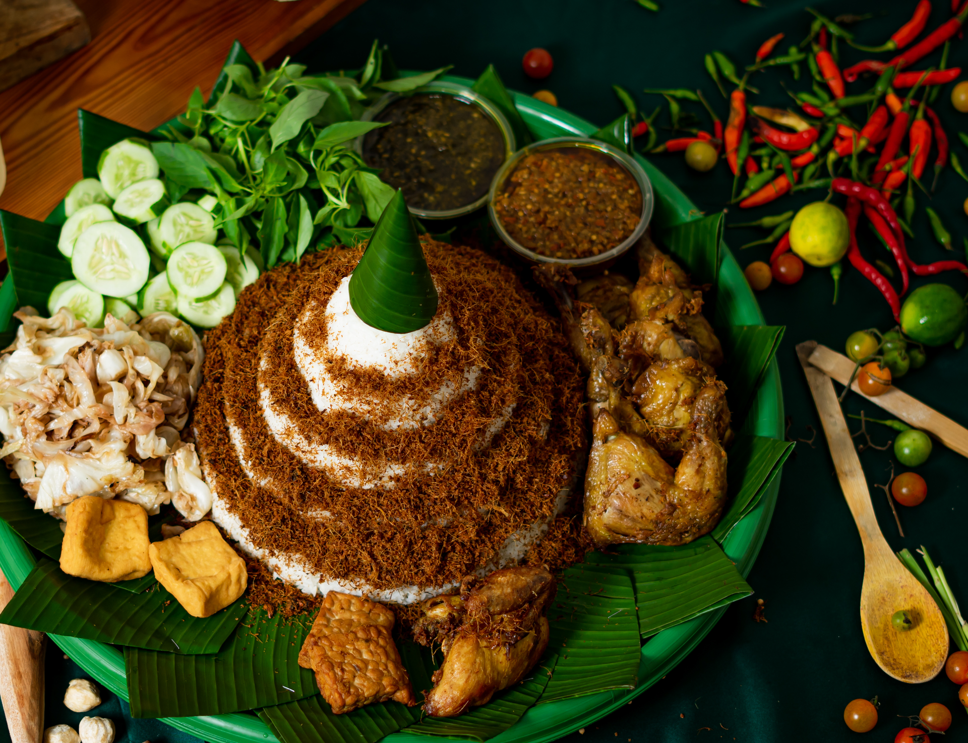 Overhead flat-lay of all ingredients for Indonesian Ketoprak with Rice Cake and Satay Sauce laid out on a kitchen surface.