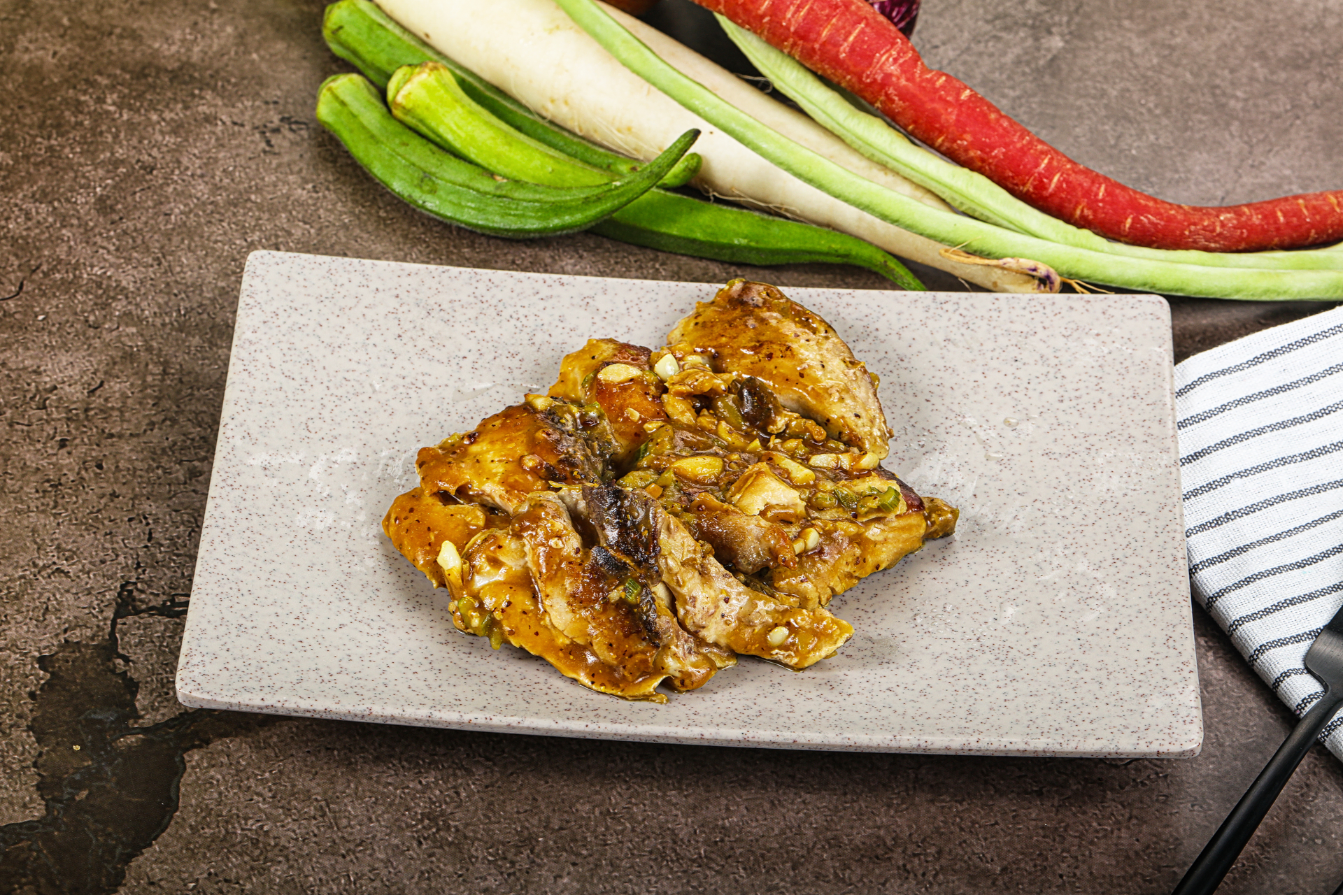 Overhead flat-lay of all ingredients for Indonesian Tempeh Goreng Manis with Tamarind Sauce laid out on a kitchen surface.