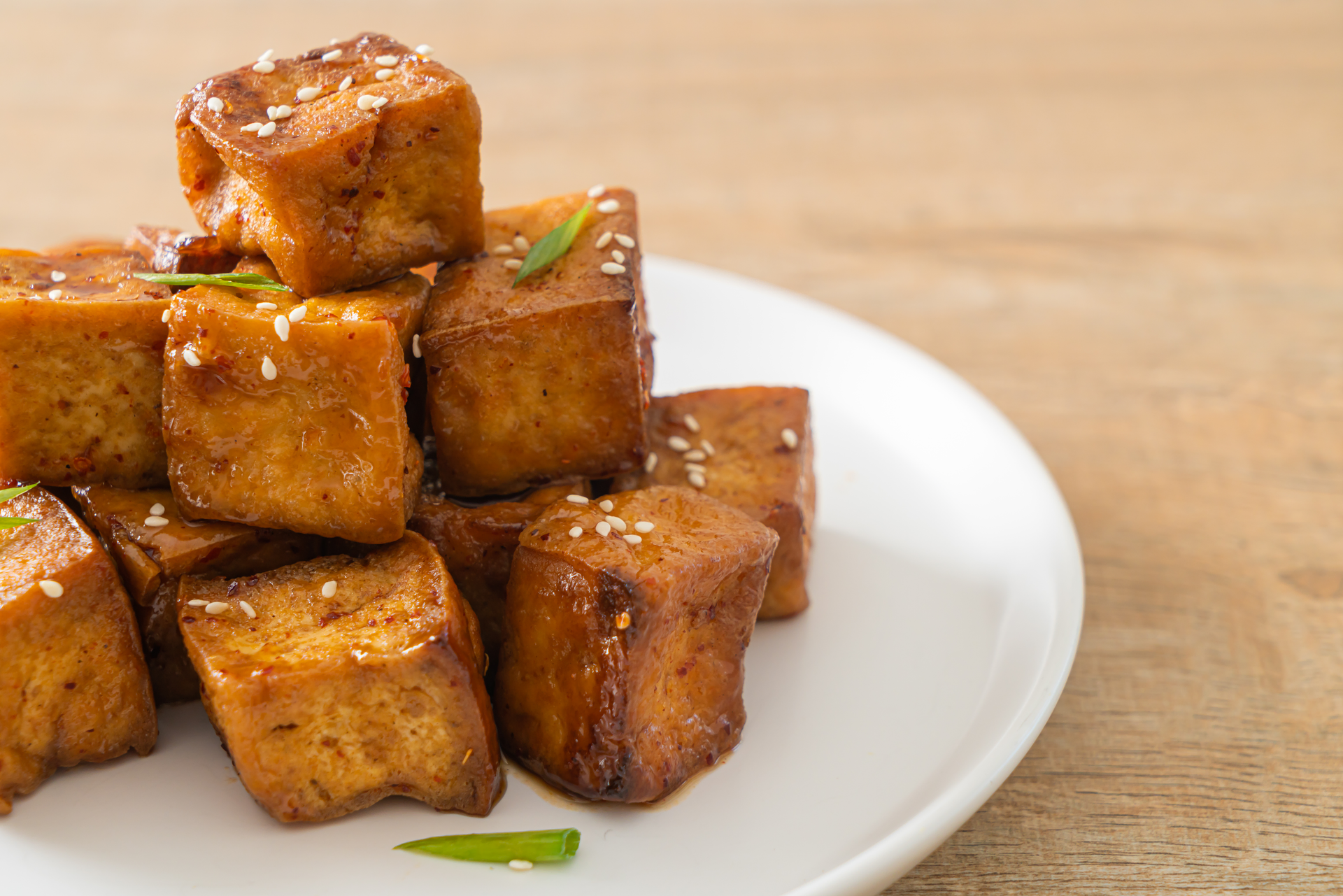Overhead flat-lay of all ingredients for Indonesian Terik Tempeh with Sweet Soy Sauce Glaze laid out on a kitchen surface.