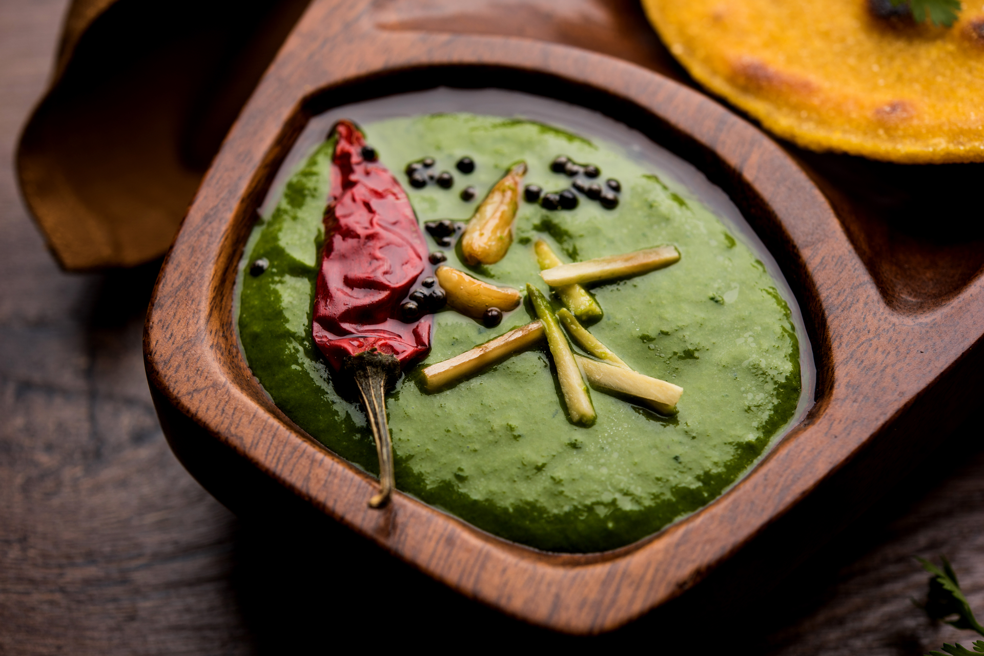 Overhead flat-lay of all ingredients for Indulgent Mexican Chocolate and Avocado Mousse with Chili Pepper Sprinkle laid out on a kitchen surface.