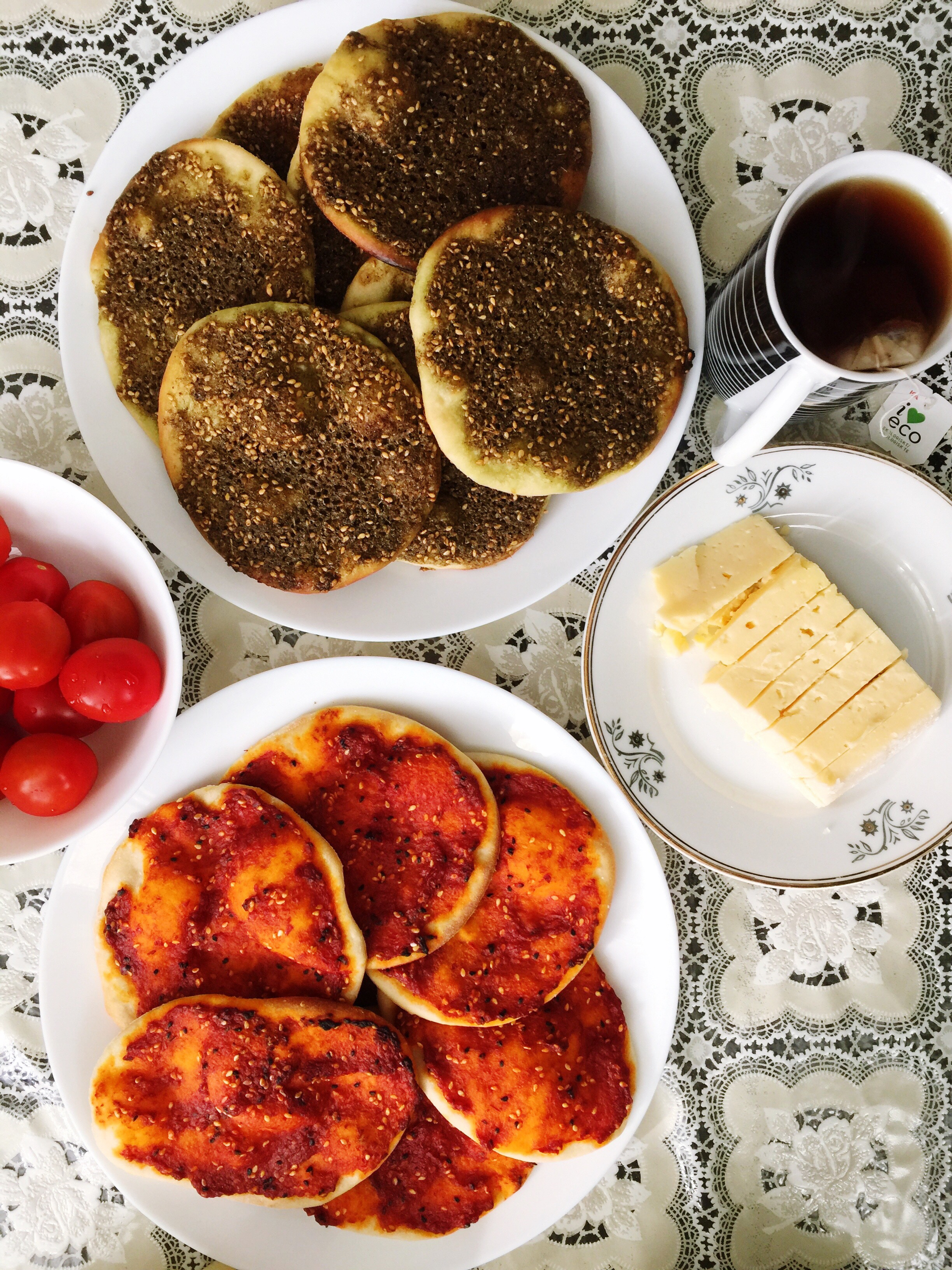 Overhead flat-lay of all ingredients for Infused Tunisian Berkoukes with Caramelized Onion and Date laid out on a kitchen surface.