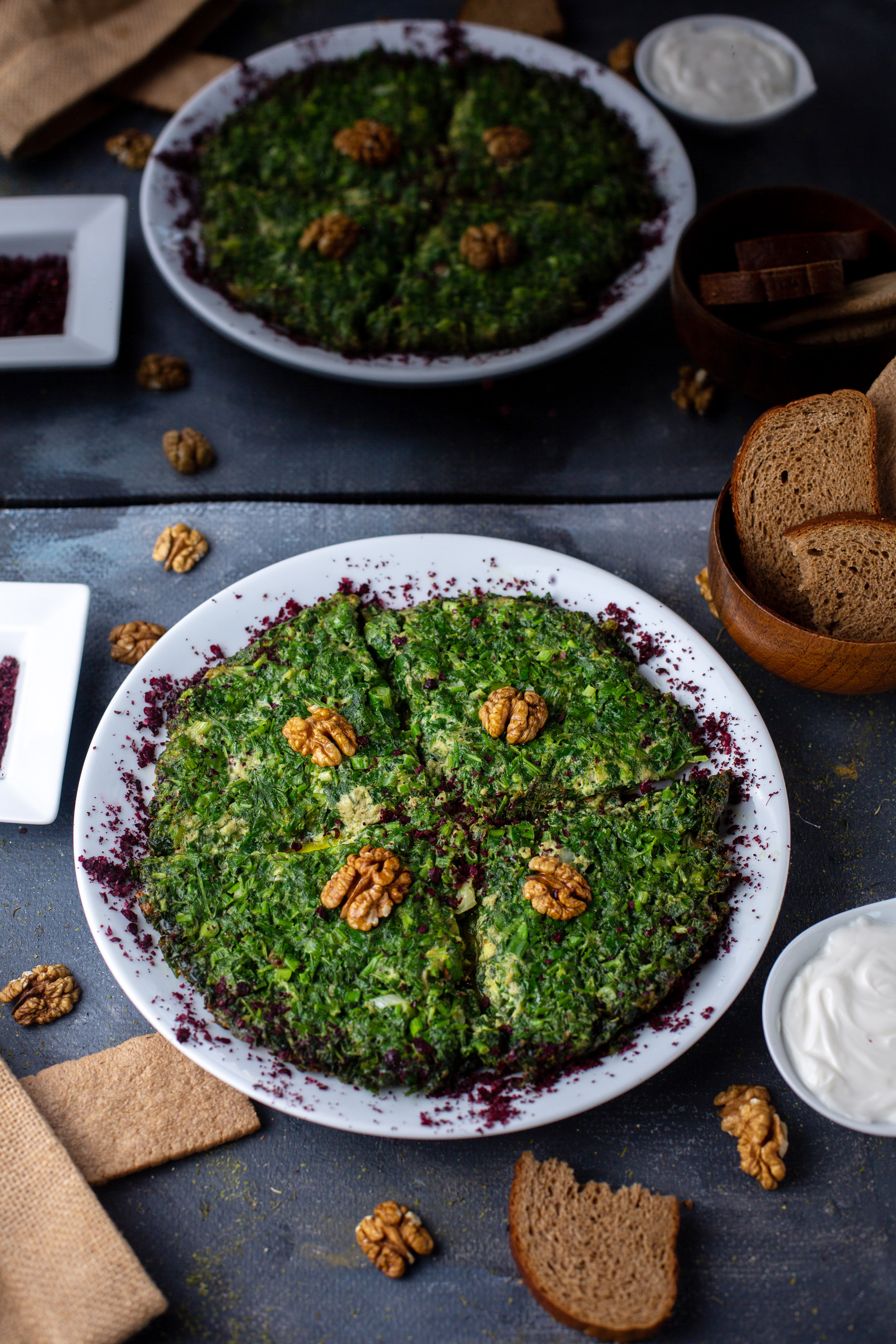 Overhead flat-lay of all ingredients for Iranian Sabzi Polo with Herbed Rice and Fresh Dill laid out on a kitchen surface.
