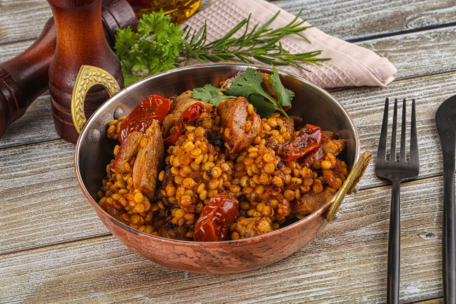 Overhead flat-lay of all ingredients for Iraqi Spicy Baharat-Glazed Chicken with Lentil Pilaf laid out on a kitchen surface.