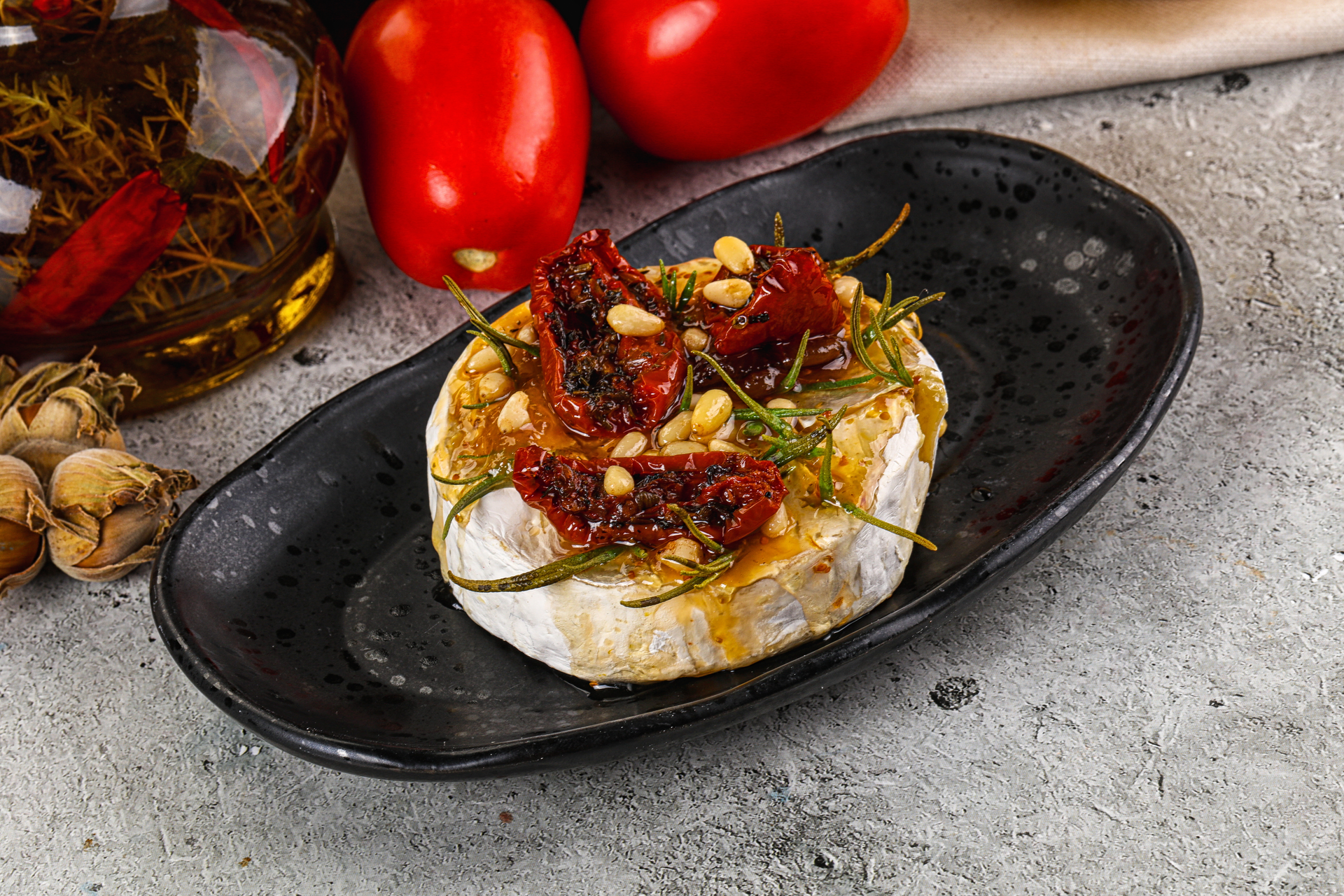 Overhead flat-lay of all ingredients for Italian Burrata and Roasted Fig Salad with Balsamic Glaze laid out on a kitchen surface.