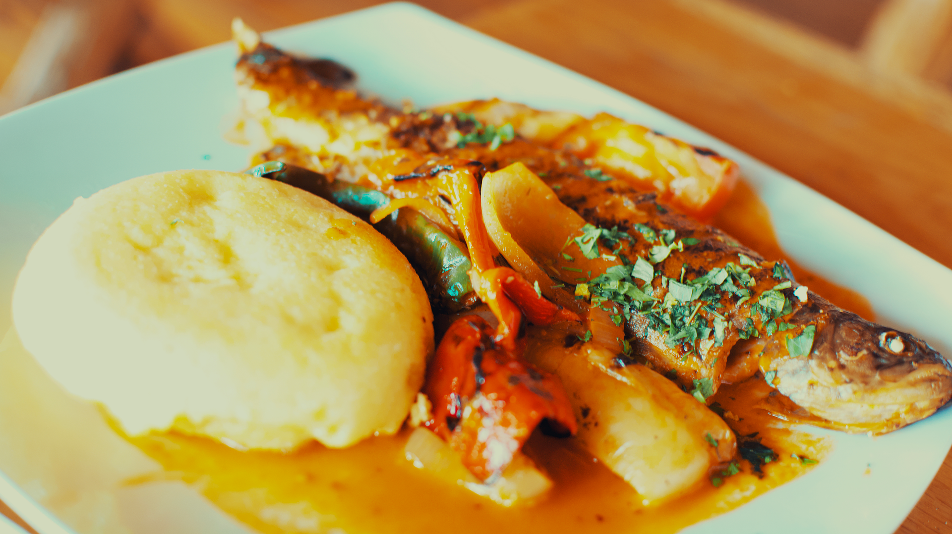 Overhead flat-lay of all ingredients for Jamaican Calypso Coconut Curry with Grilled Grouper laid out on a kitchen surface.